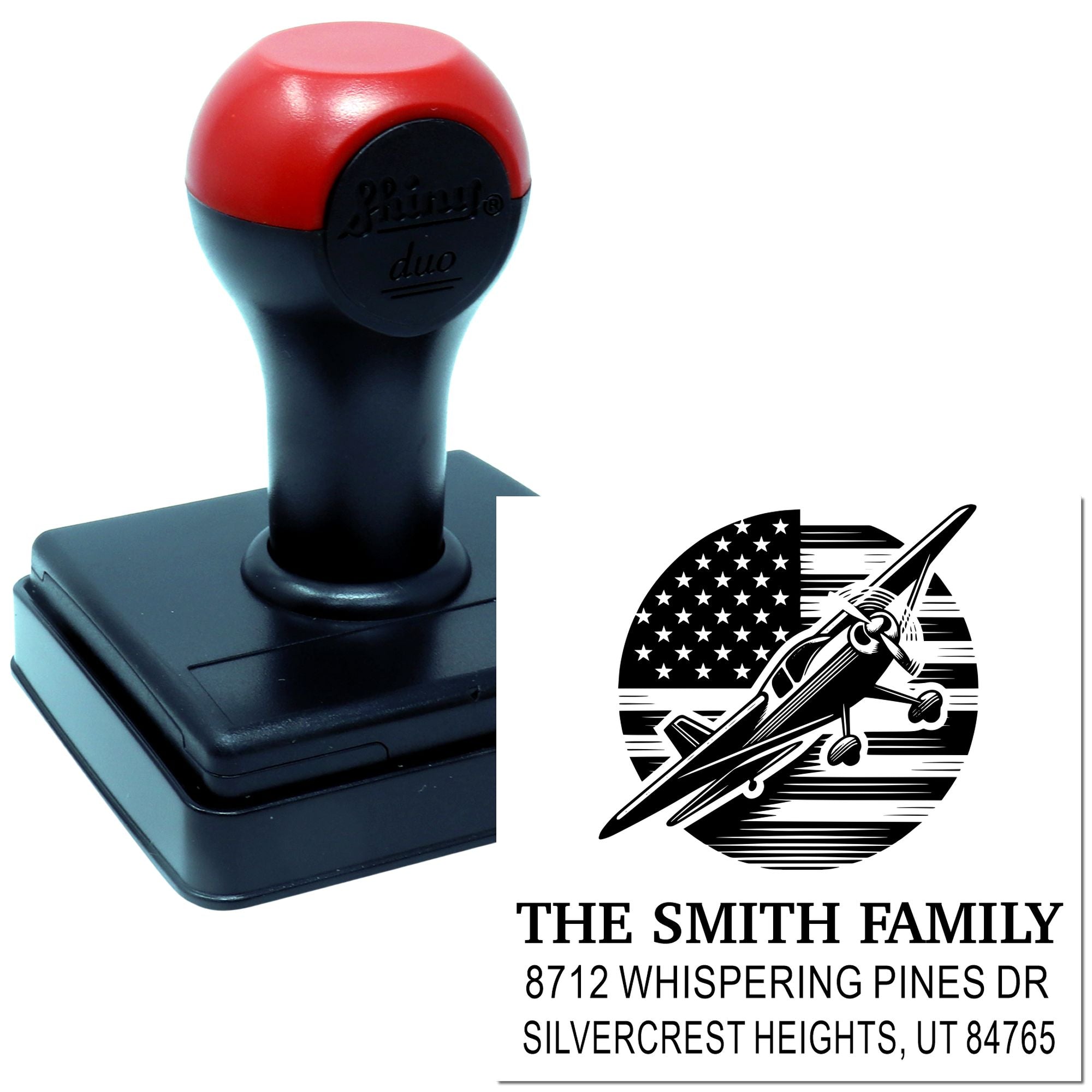 Custom self-inking address stamp on white background, featuring an airplane logo, family name, and Utah address.
