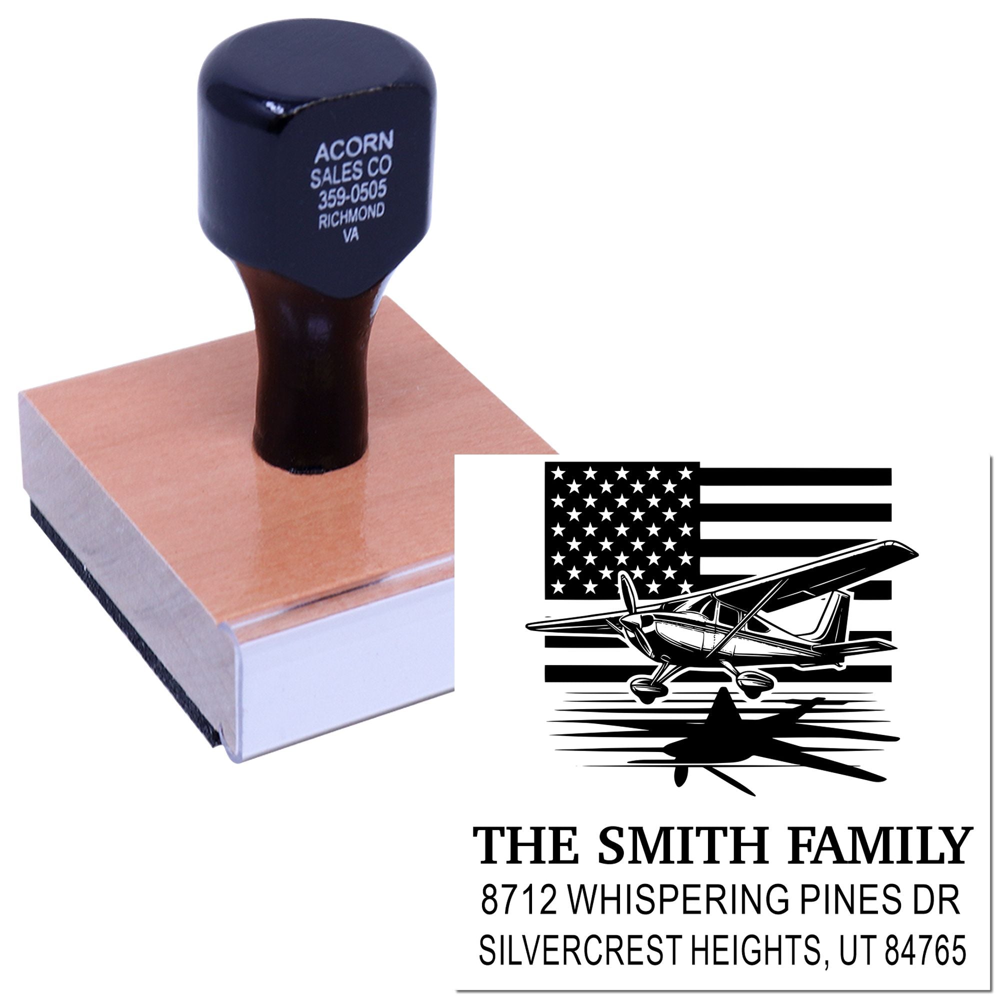 Custom address stamp with airplane and U.S. flag design, shown on a wooden base, alongside a family return-address imprint.