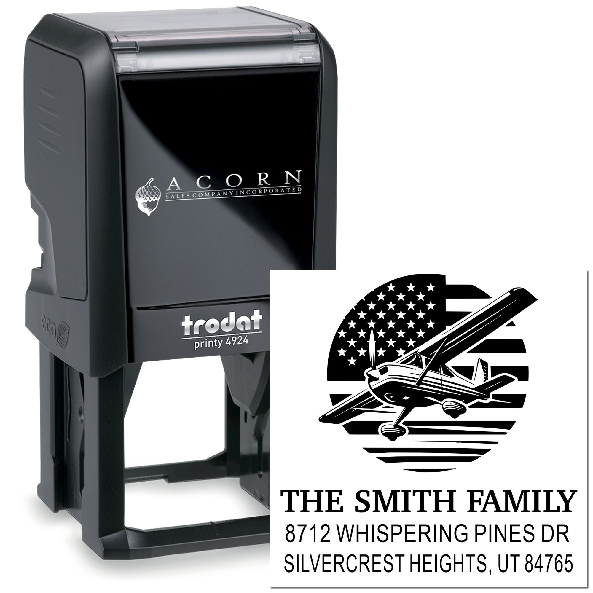Custom self-inking address stamp with airplane and American flag design, The Smith Family name and address on black Trodat stamp product display.