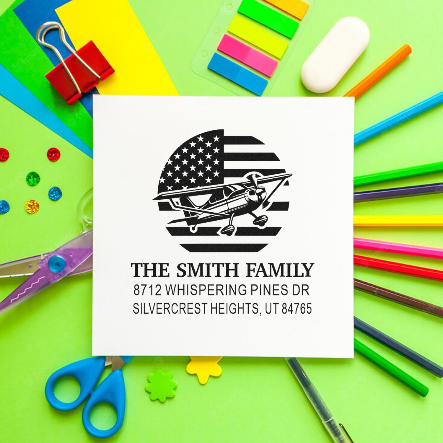 Personalized family stamp with airplane and American flag design, showing The Smith Family address on a colorful stationery background.