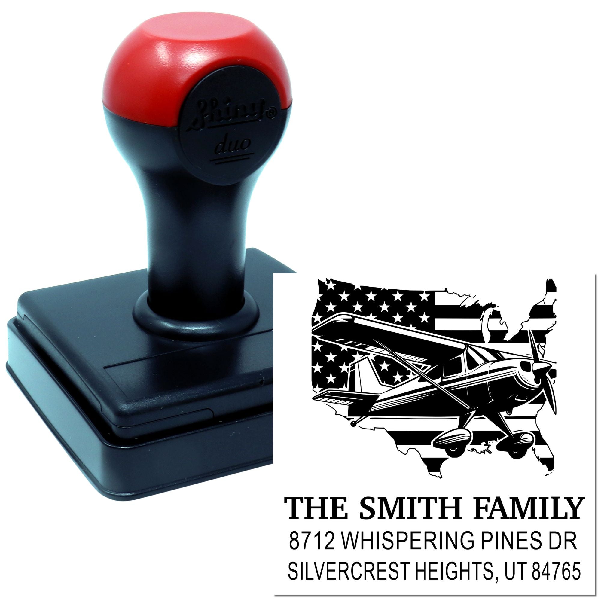 Custom self-inking address stamp with airplane and American flag state design, black-and-red stamp on white background, showing Smith family address.