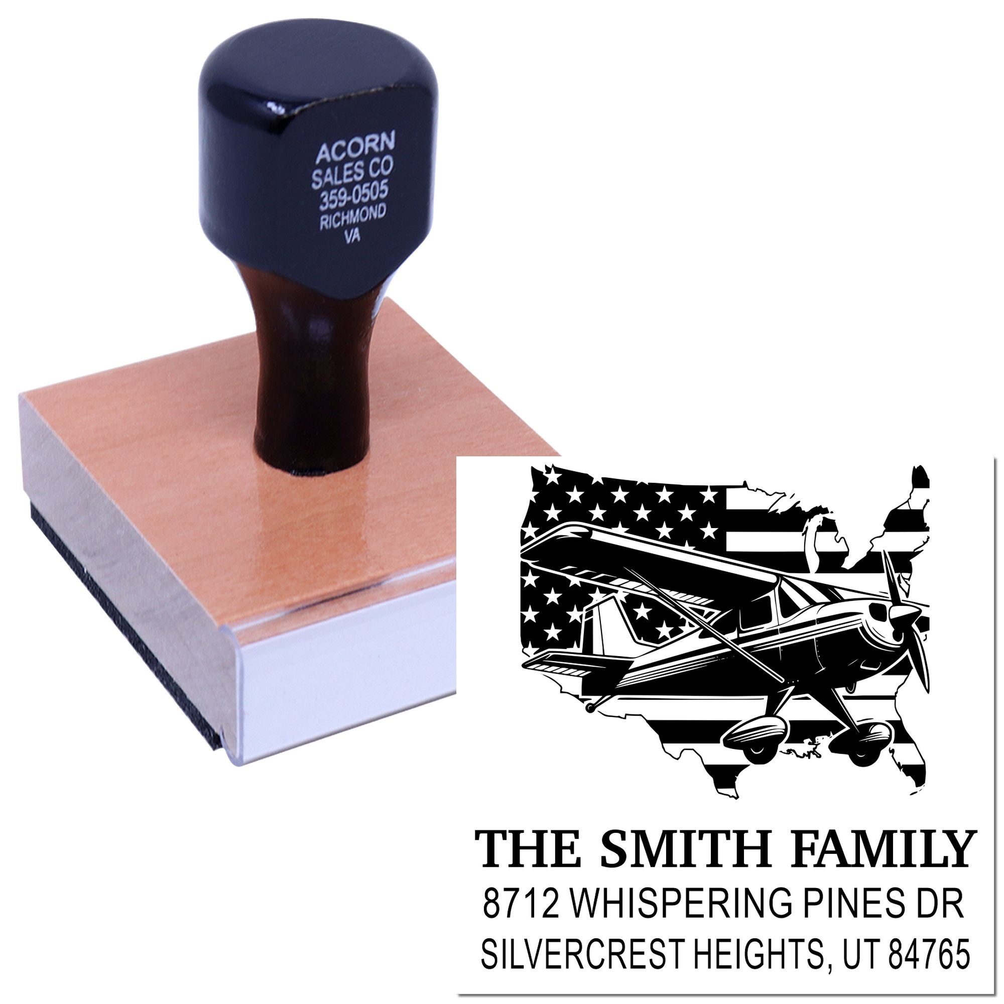 Custom address rubber stamp with airplane and U.S. flag graphic, shown pressed on a wood block on white background with sample imprint for The Smith Family.