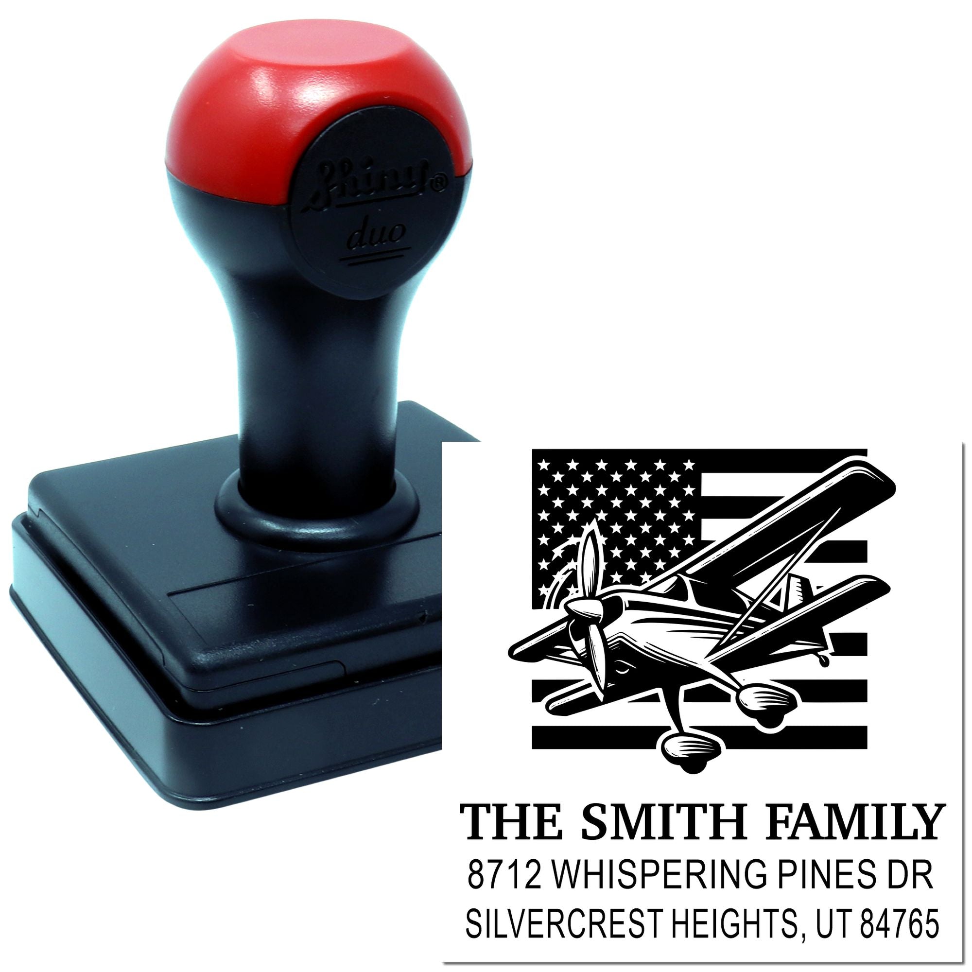 Custom self-inking address stamp with patriotic airplane design, The Smith Family name, and Utah mailing address on a white background.