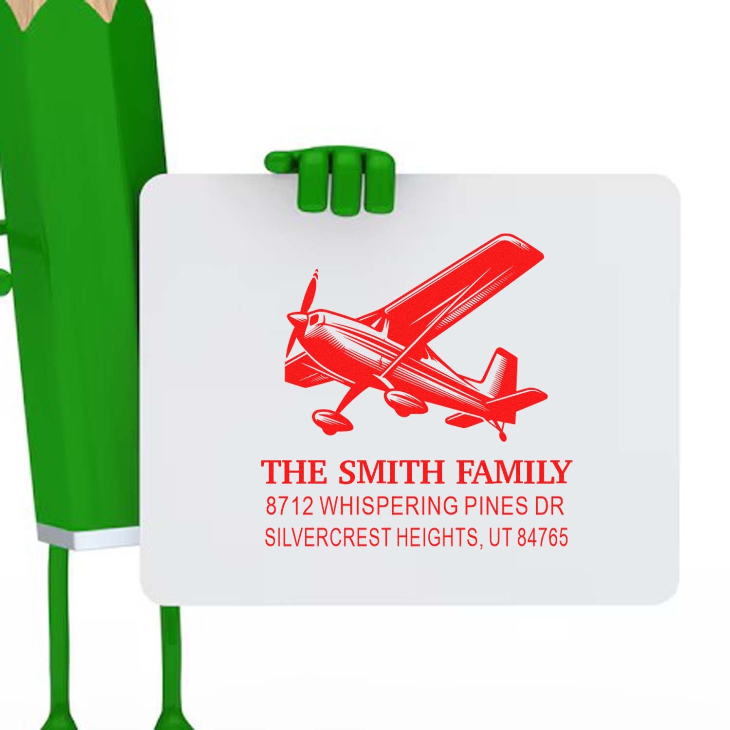 Custom self-inking family address stamp with red airplane design, held by a green character on a white background, personalized for The Smith Family.