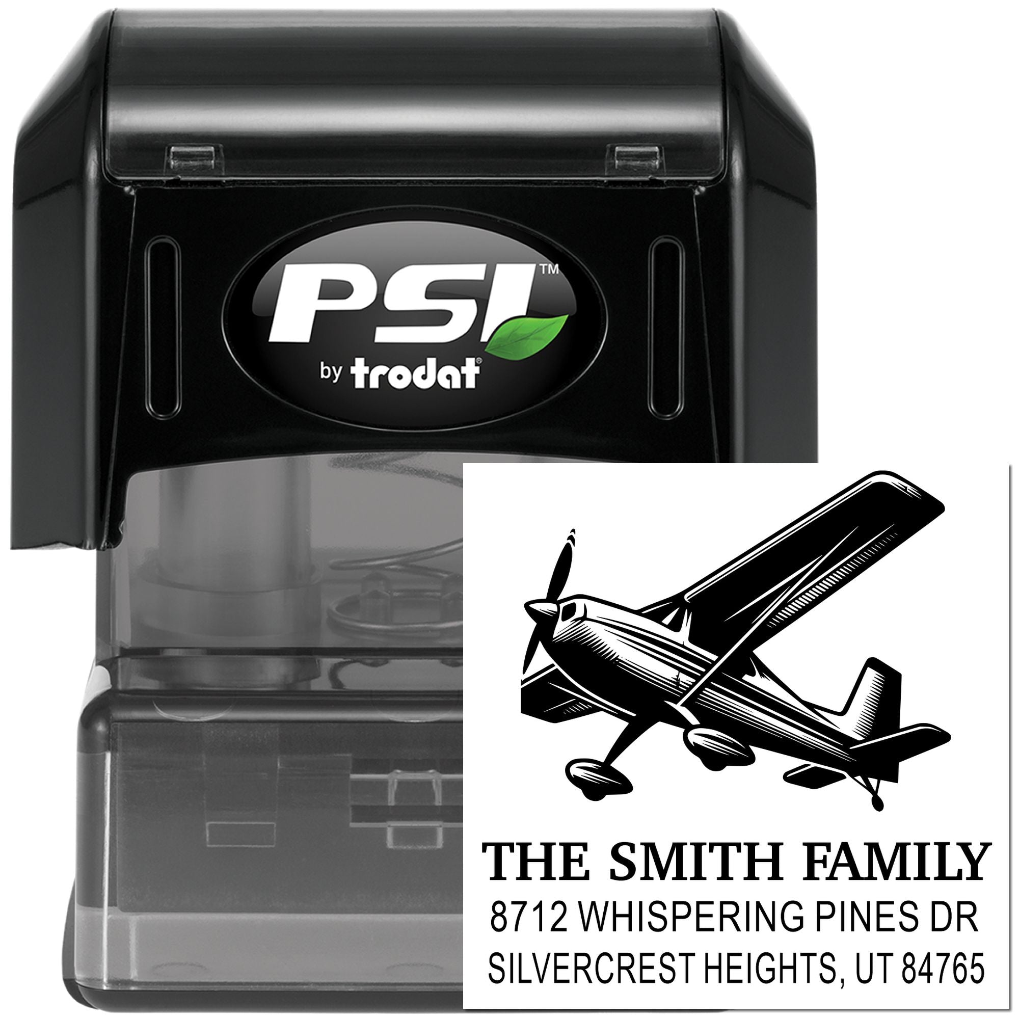 Self-inking PSI by Trodat custom address stamp with airplane graphic, The Smith Family address, shown on a black stamp case against a white background.
