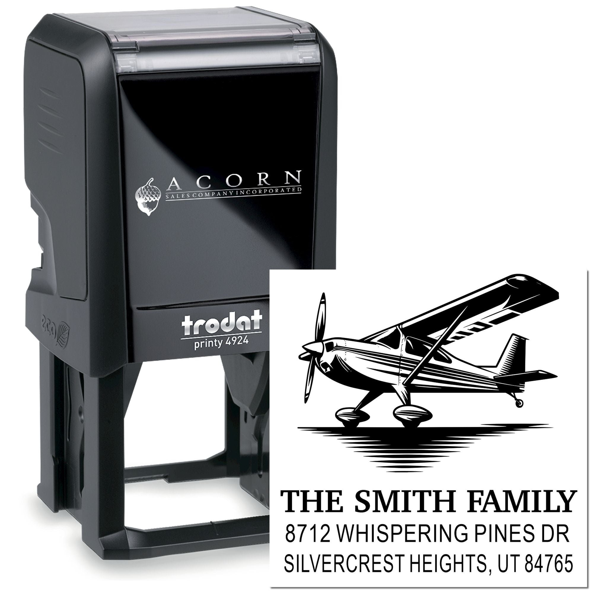 Custom self-inking address stamp with airplane design, showing The Smith Family name and Silvercrest Heights, UT address.