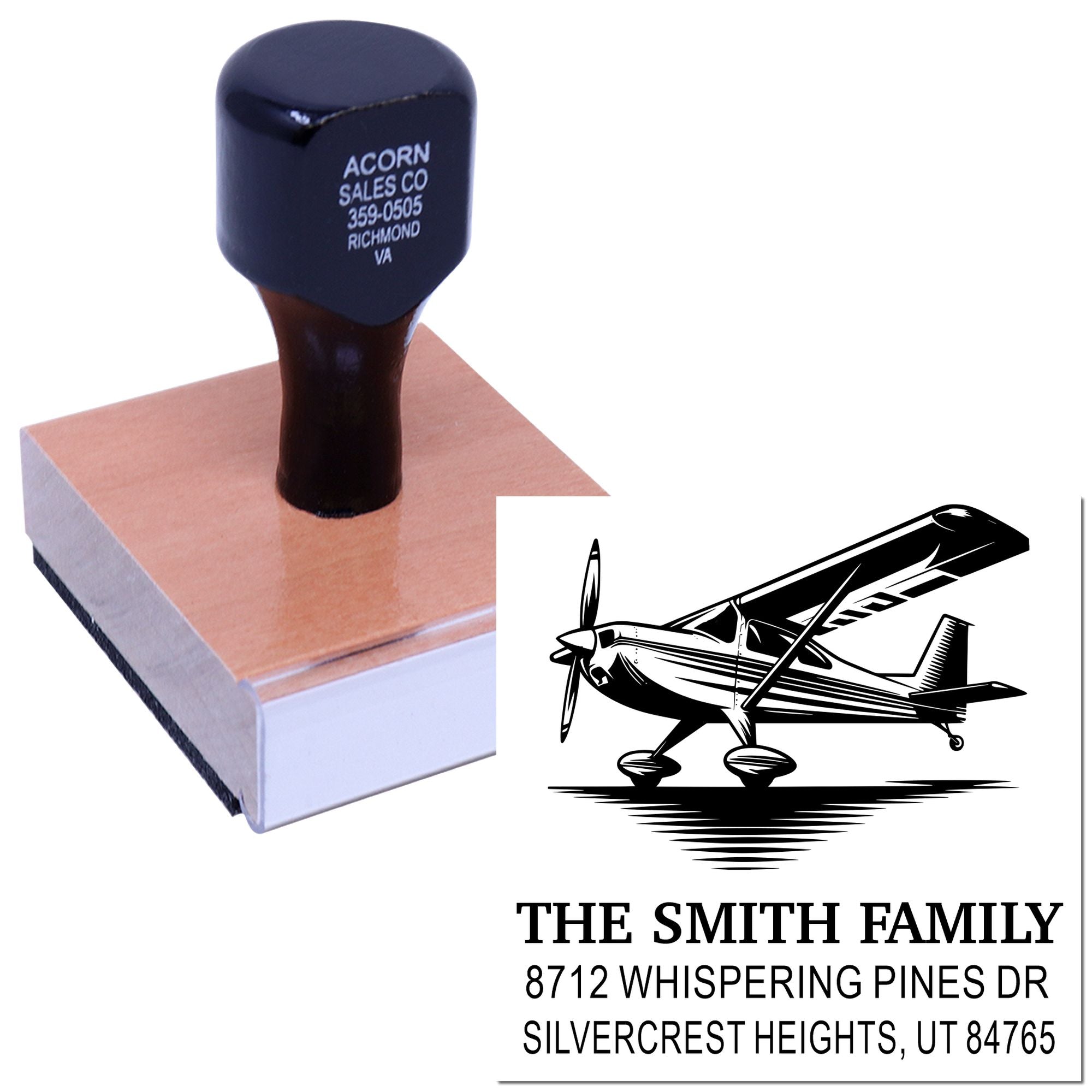 Custom self-inking address stamp with airplane graphic and The Smith Family address, shown on a wood mount with stamped impression.