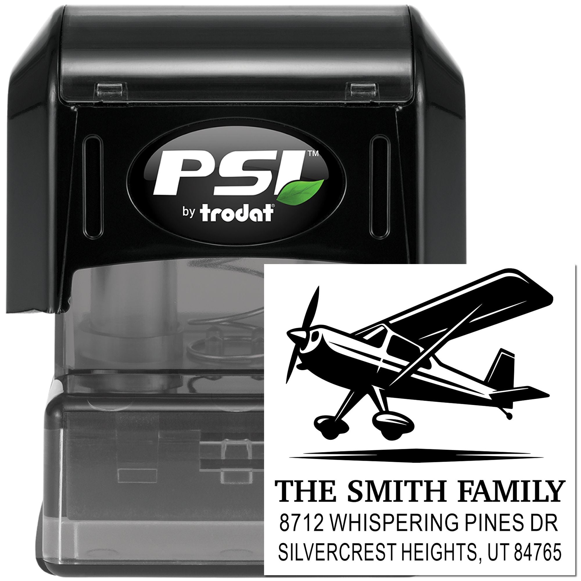PSI by Trodat self-inking address stamp with airplane design, showing The Smith Family return address on a white background.