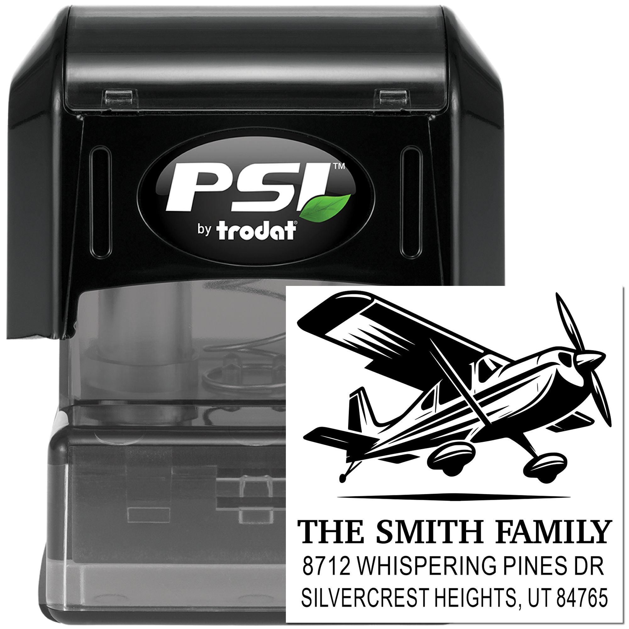 PSI by Trodat self-inking stamp with airplane address design for The Smith Family, shown on a black stamp holder with custom return-address imprint.