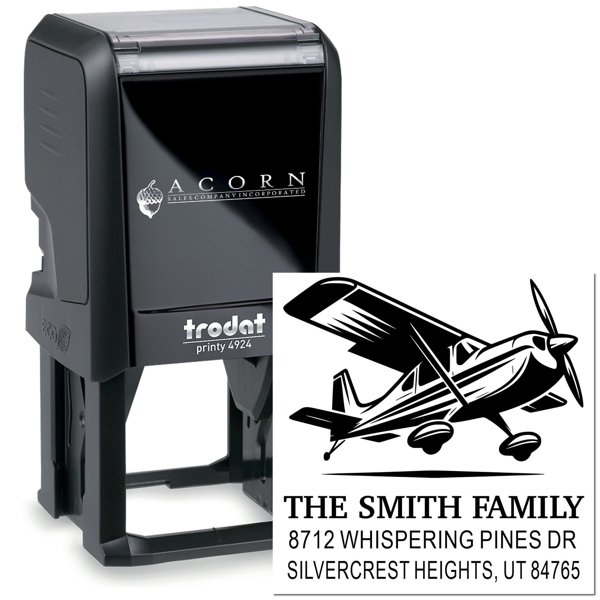Custom self-inking Trodat Printy 4924 stamp with airplane logo and Smith family address, shown on a white background.