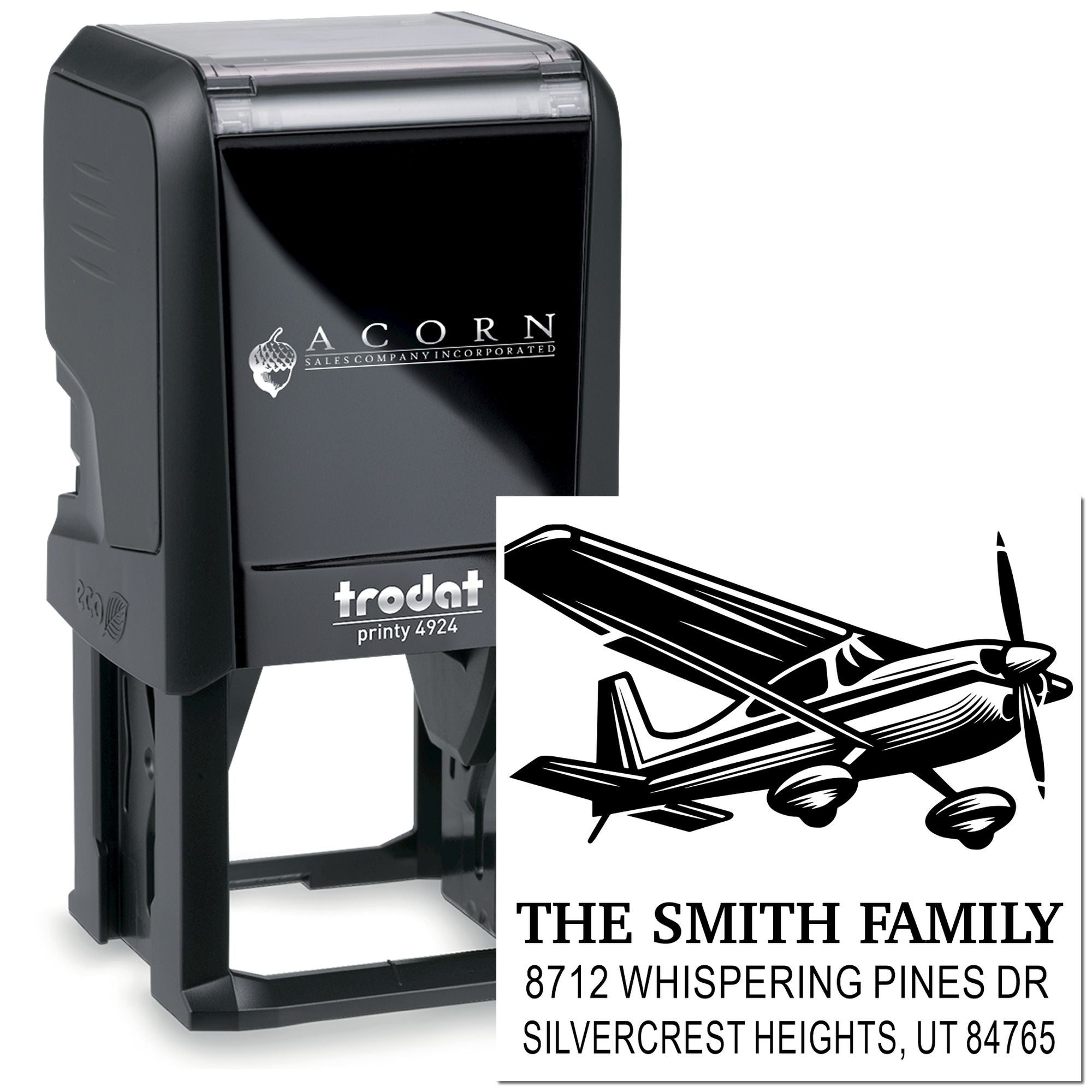 Custom self-inking Trodat stamp with airplane design, The Smith Family name and address, shown on a white background.