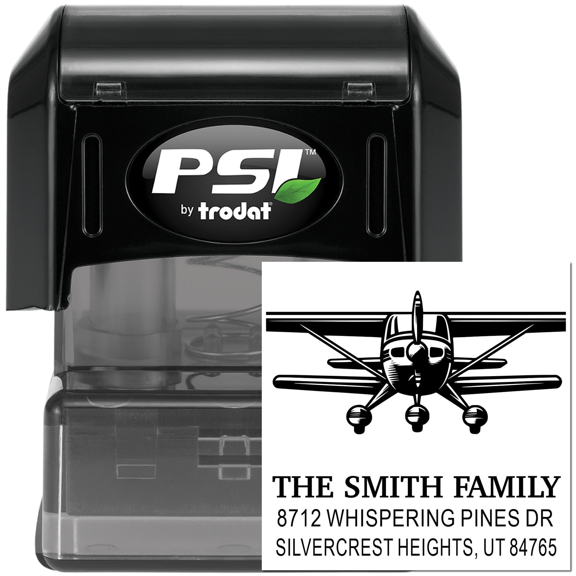 Custom self-inking rubber stamp with airplane logo, family name, and return address, black PSI by Trodat stamp for mailing and labeling.
