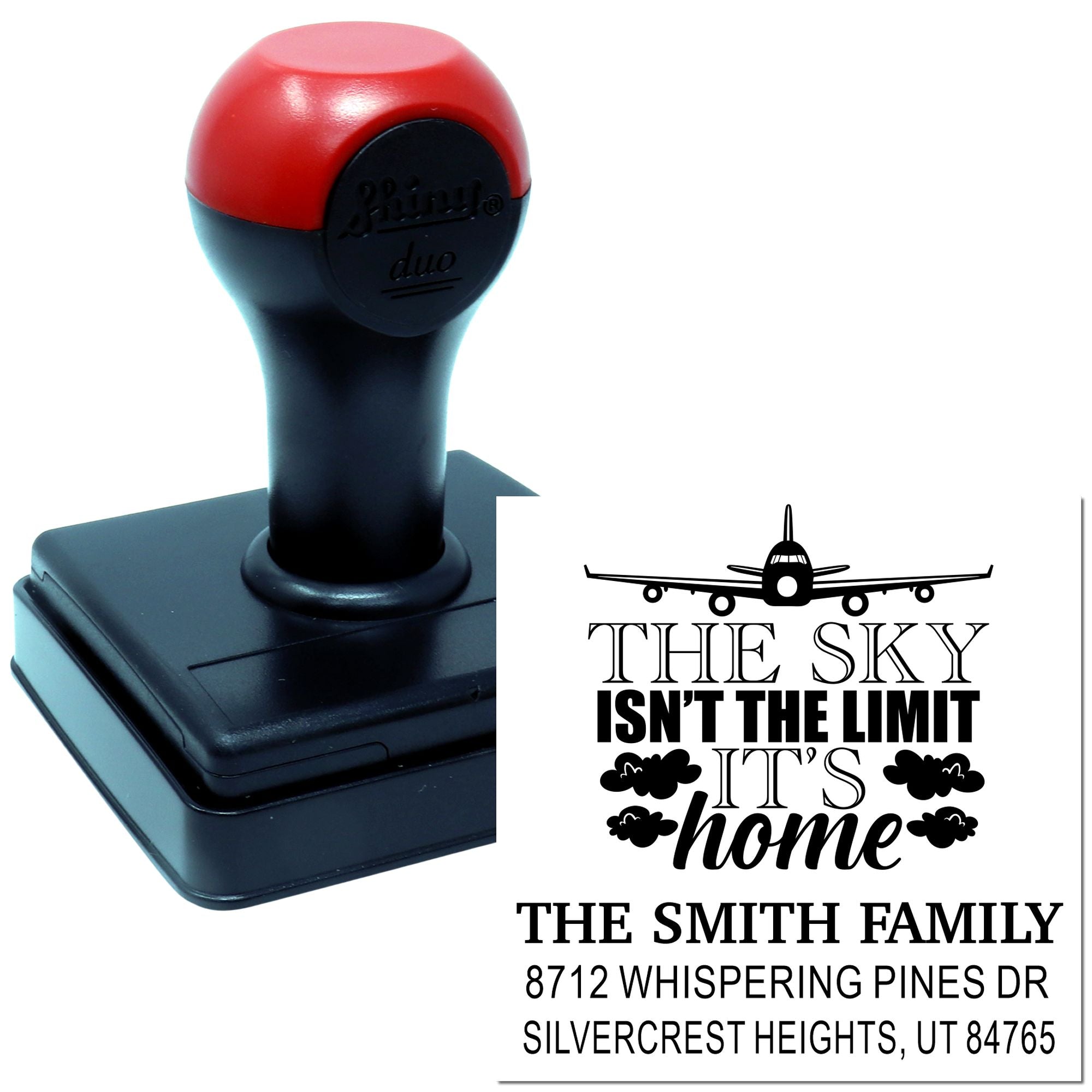 Custom self-inking stamp with airplane design and The sky isnt the limit, its home family address imprint on a white background.