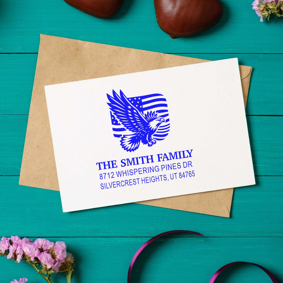 Custom patriotic return address rubber stamp with eagle and American flag design, personalized with family name and address for mailing envelopes.