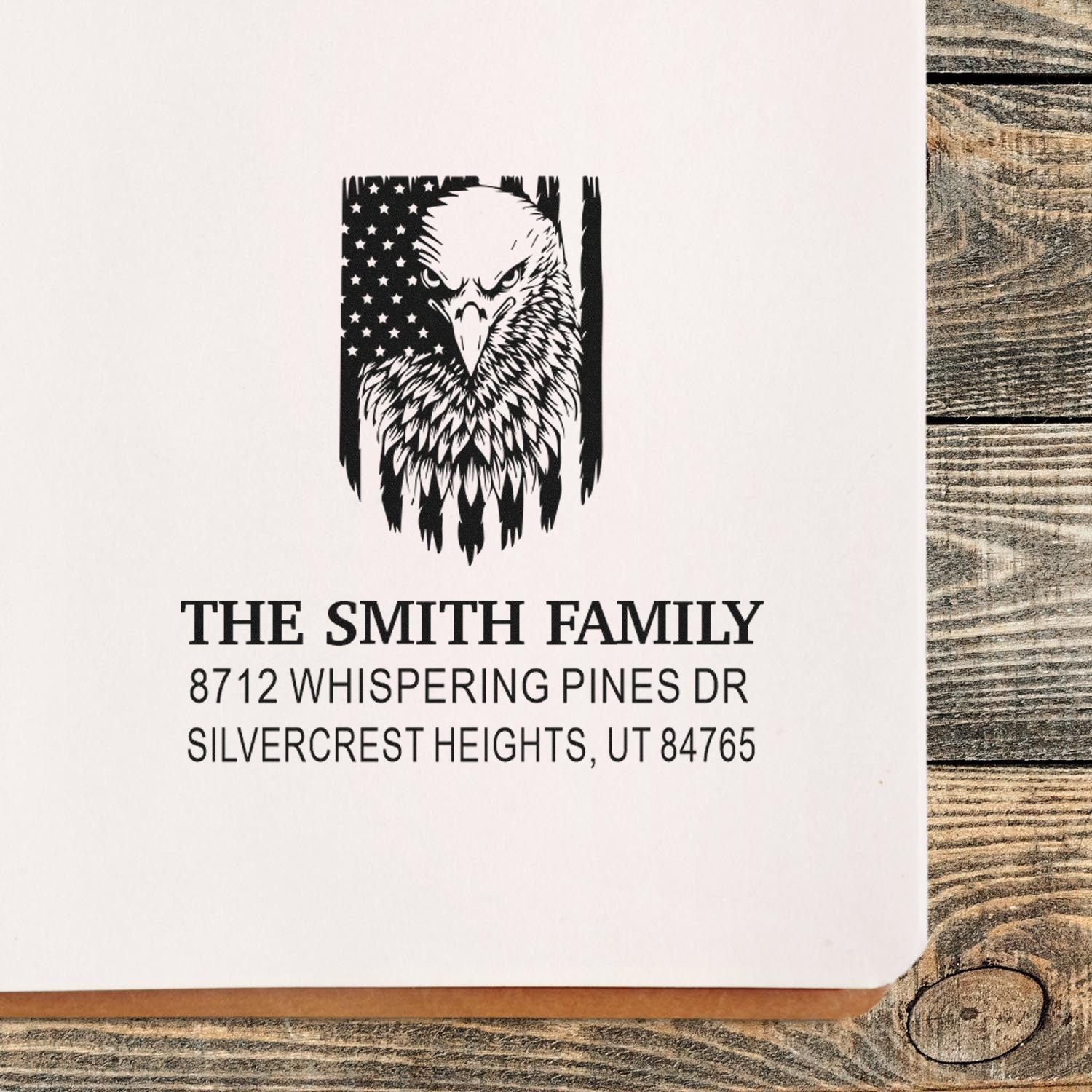 Custom rubber address stamp with eagle and American flag design, personalized family name, street address, city, state and ZIP code for mail and stationery