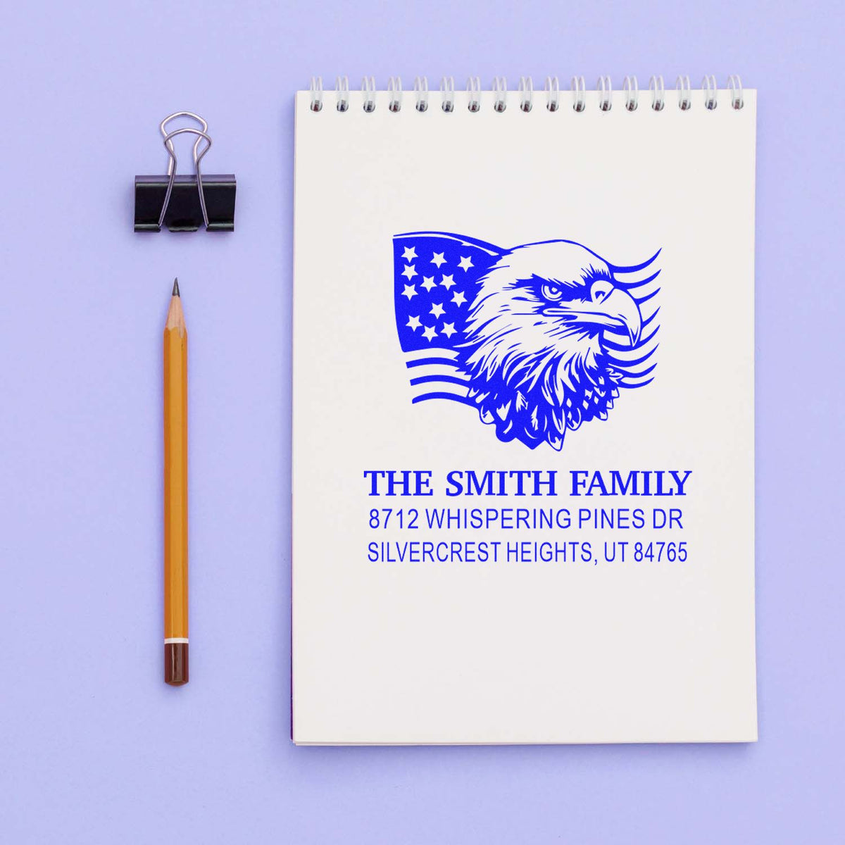 Custom rubber return address stamp with patriotic eagle and American flag design for The Smith Family, 8712 Whispering Pines Dr.