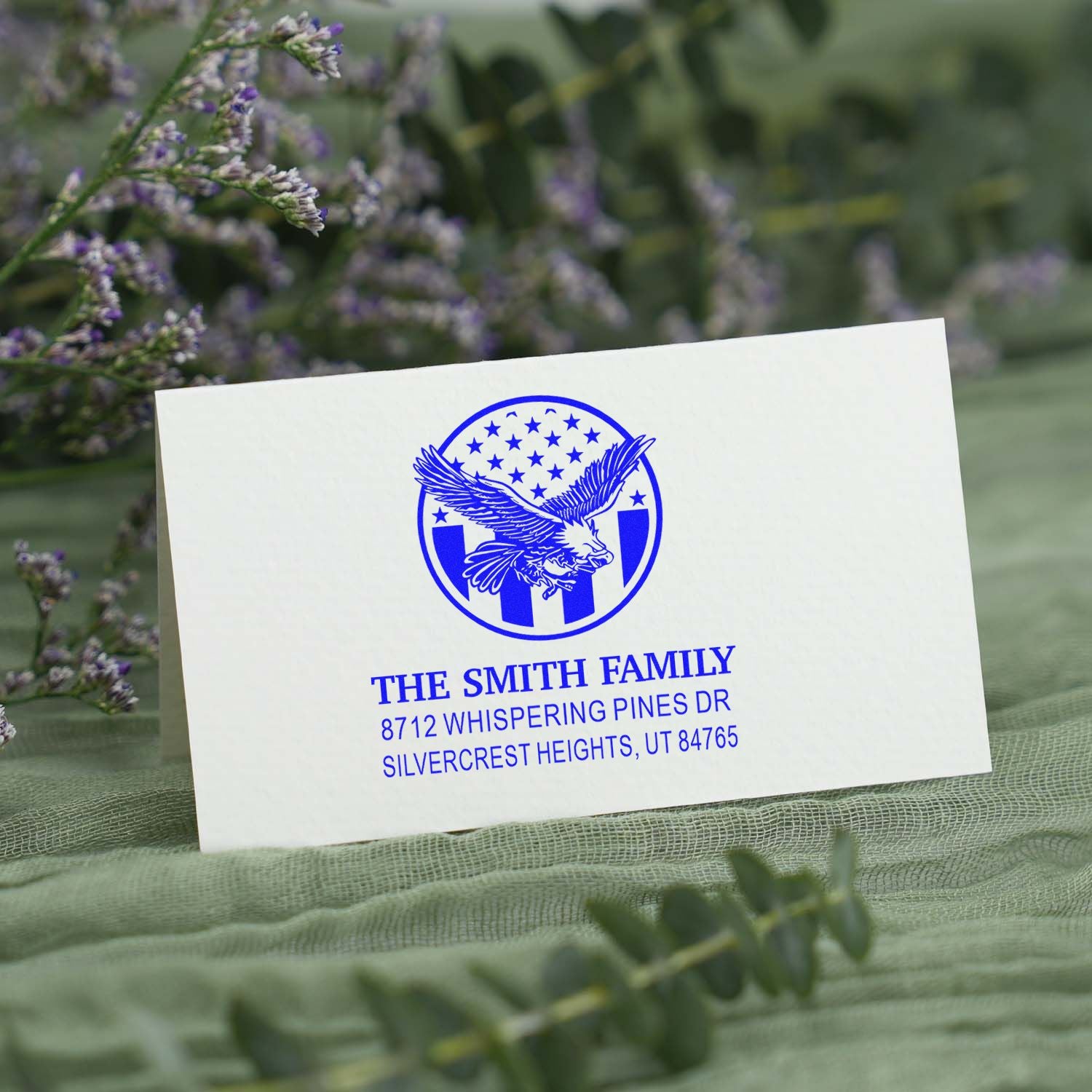 Custom rubber address stamp for The Smith Family with eagle emblem, blue ink style, featuring personalized return address in Silvercrest Heights, UT 84765.