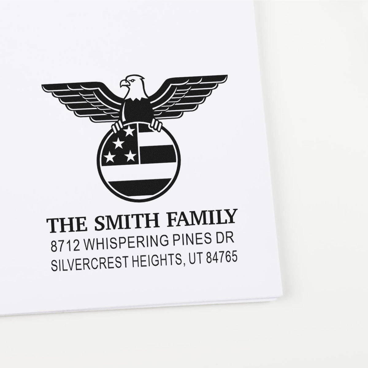 Personalized custom rubber address stamp with patriotic eagle emblem, Smith family name, and return mailing address for envelopes and holiday cards.