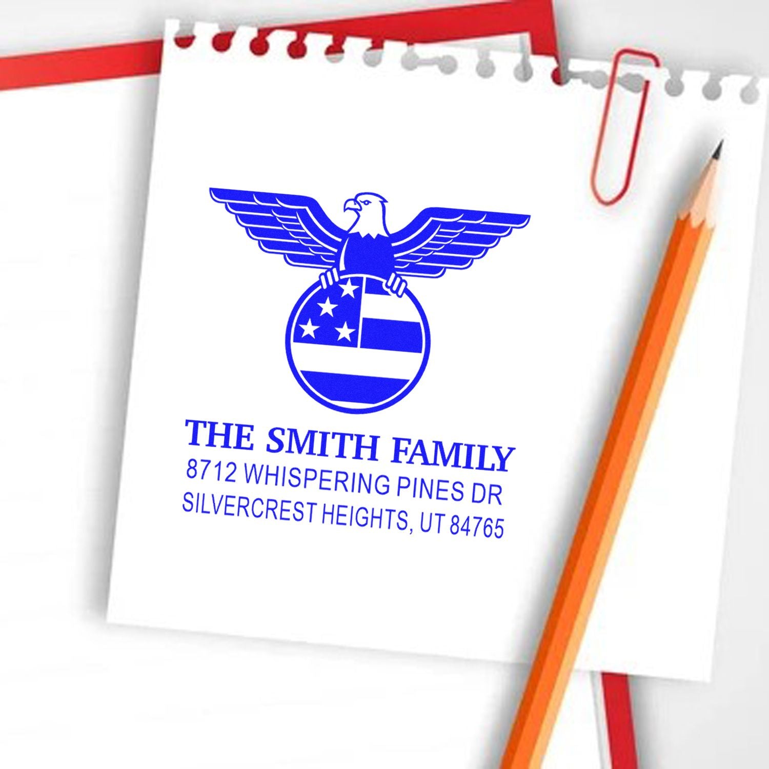 Custom family return address rubber stamp with patriotic eagle design and blue ink, personalized with name and home address for mail and stationery