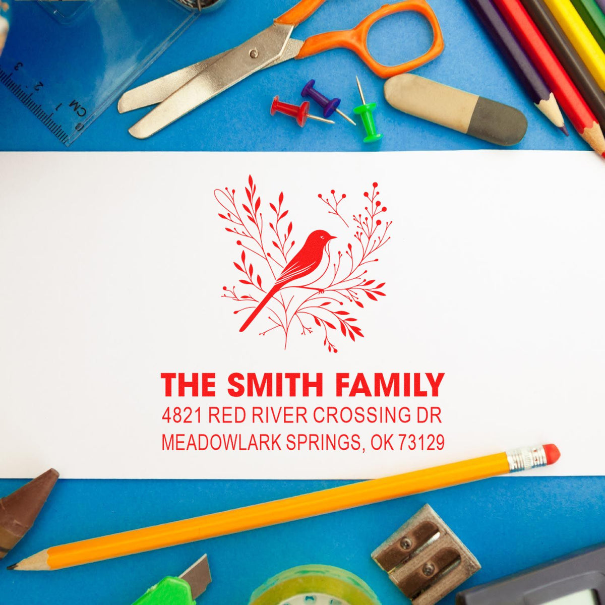 Custom family address rubber stamp with red bird and floral design, personalized for The Smith Family, Meadowlark Springs, OK 73129