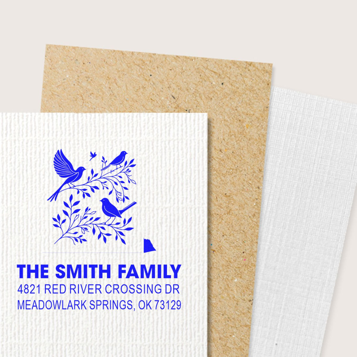 Custom return address rubber stamp with bird and branch design, personalized blue ink for The Smith Family, Meadowlark Springs, OK 73129