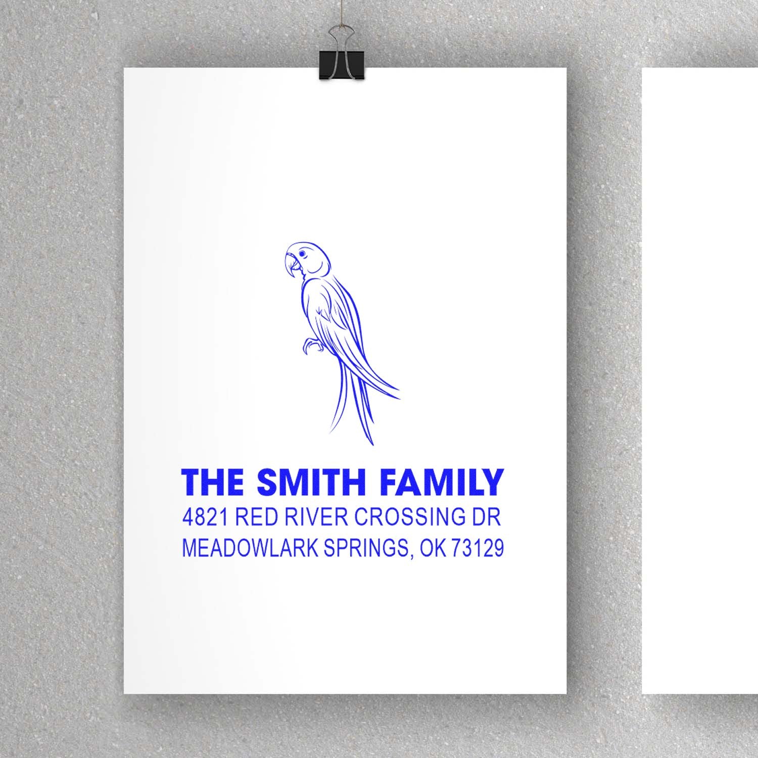 Custom rubber address stamp with parrot design, The Smith Family name, and Meadowlark Springs, OK 73129 in blue ink style