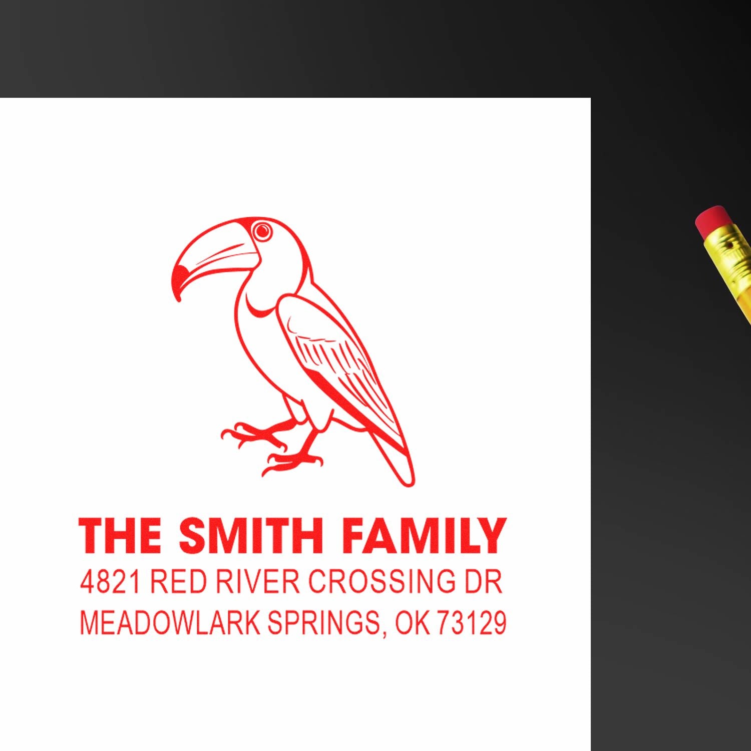 Personalized red toucan return address rubber stamp for The Smith Family, featuring custom name and Meadowlark Springs, OK address.