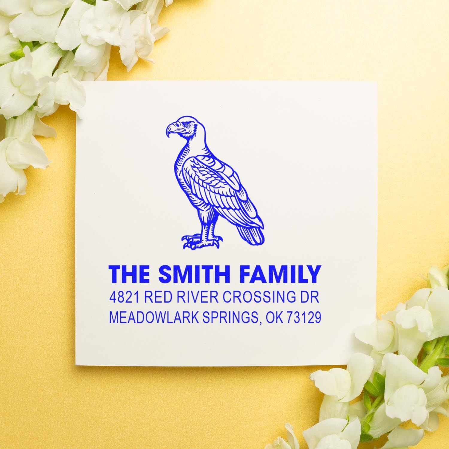 Custom return address rubber stamp with blue eagle logo for The Smith Family, featuring 4821 Red River Crossing Dr, Meadowlark Springs, OK 73129.
