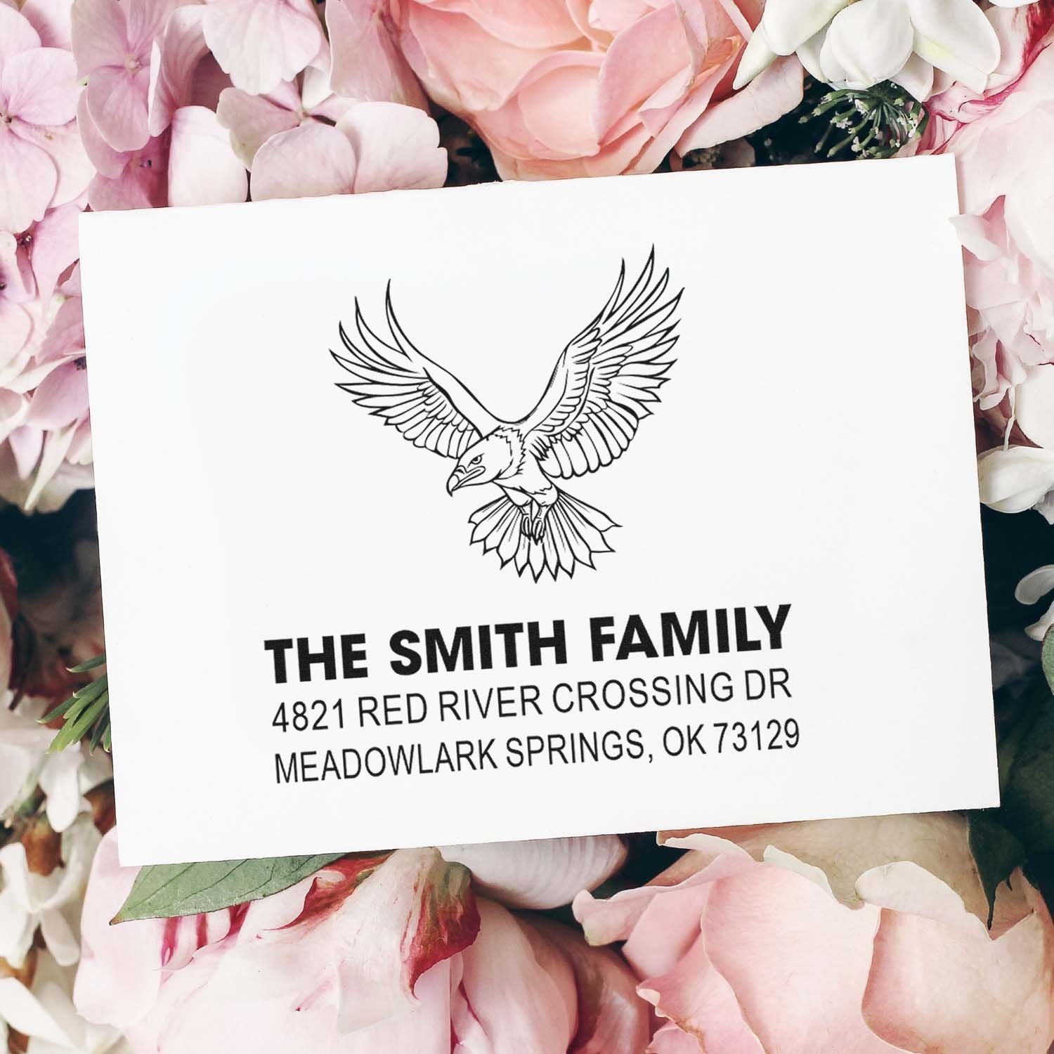 Custom rubber return address stamp with eagle design, personalized The Smith Family name and address for mailing envelopes and cards.