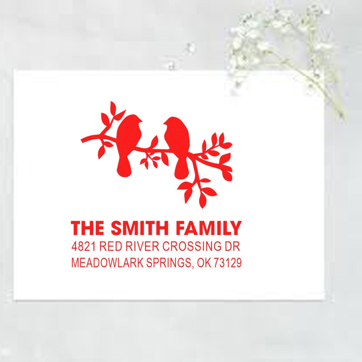 Custom family return address rubber stamp with two birds on a branch, red ink style, featuring The Smith Family and Meadowlark Springs, OK address.