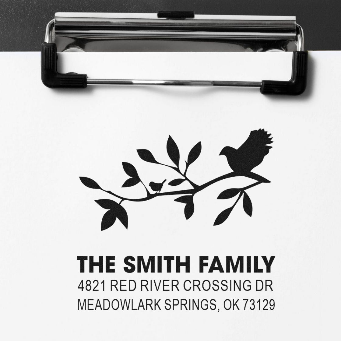 Custom family return address rubber stamp with bird and branch design, featuring The Smith Family and full address for envelopes and correspondence.