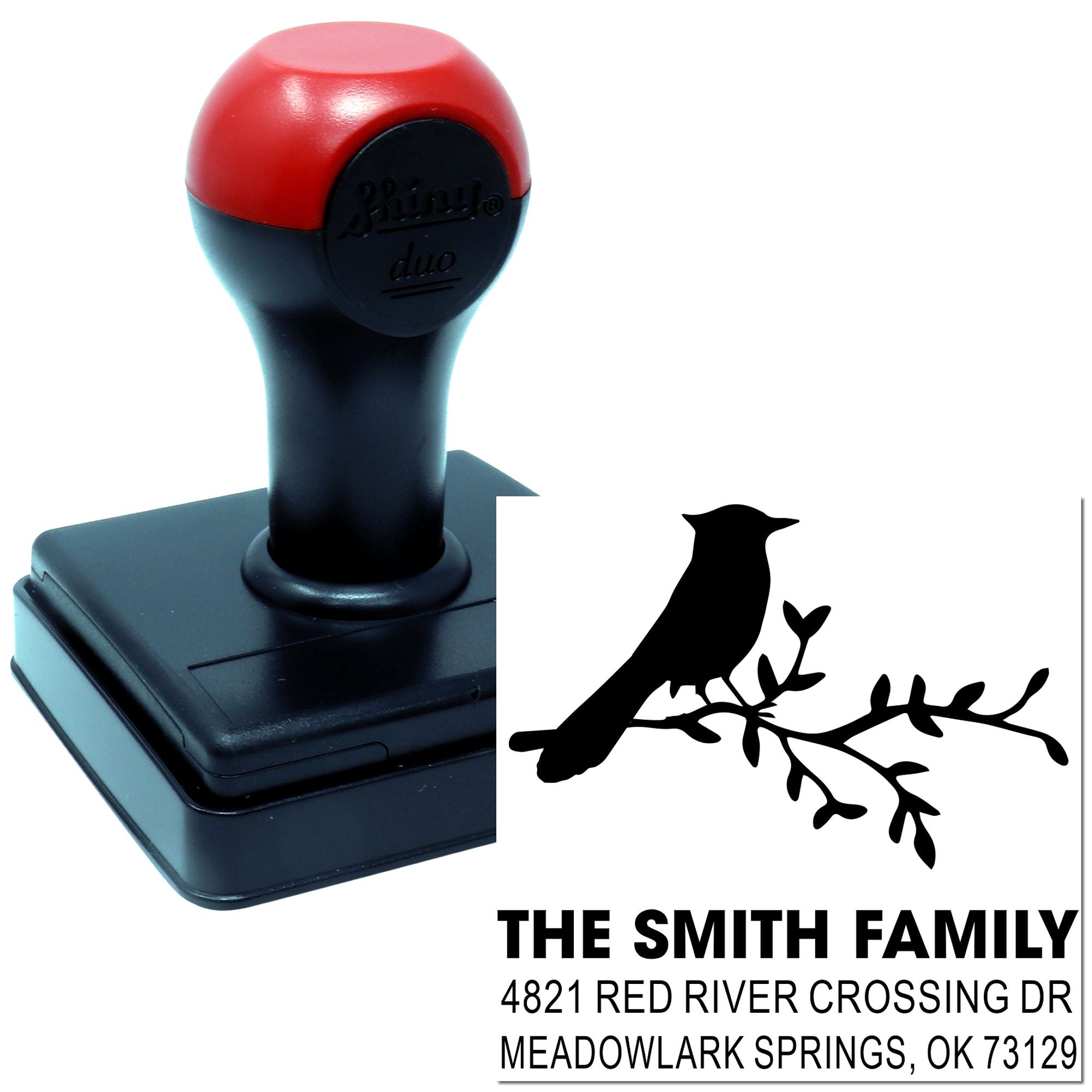 Custom self-inking rubber stamp with bird on branch design and return address for The Smith Family, featuring durable red and black stamp handle.