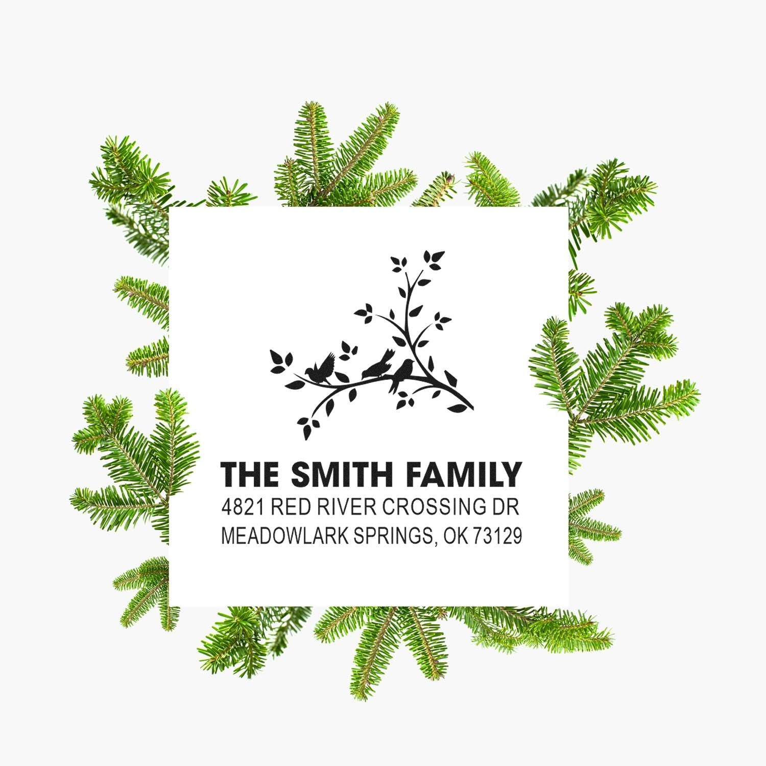 Personalized return address rubber stamp with family name, bird and branch design, and custom mailing address for holiday cards and envelopes.