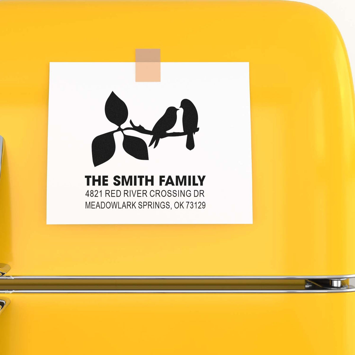Personalized custom rubber stamp with bird and leaf design, featuring The Smith Family name and Meadowlark Springs, OK return address for mailing.