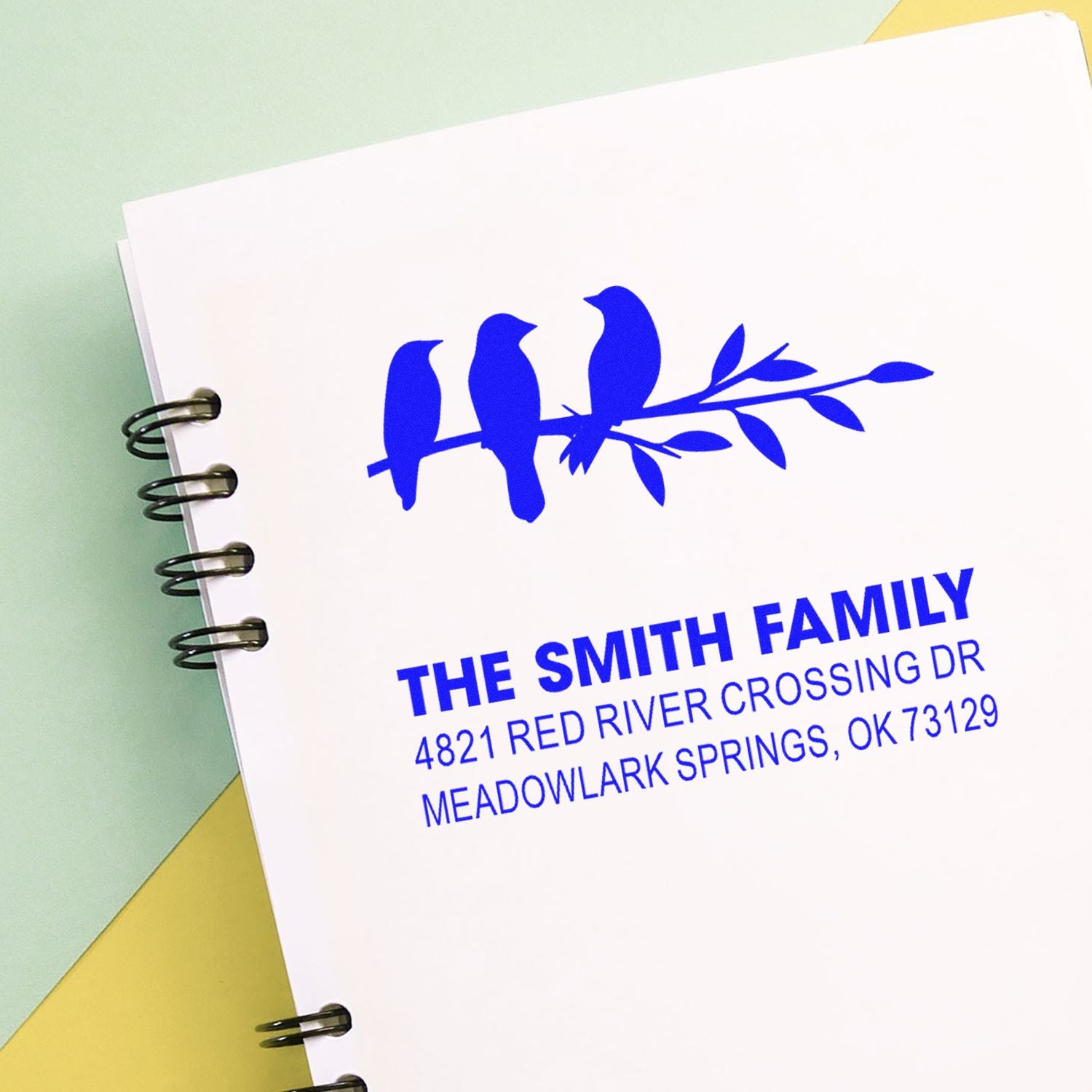 Custom rubber address stamp with three birds on a branch, blue ink, personalized Smith family return address for stationery and envelopes.