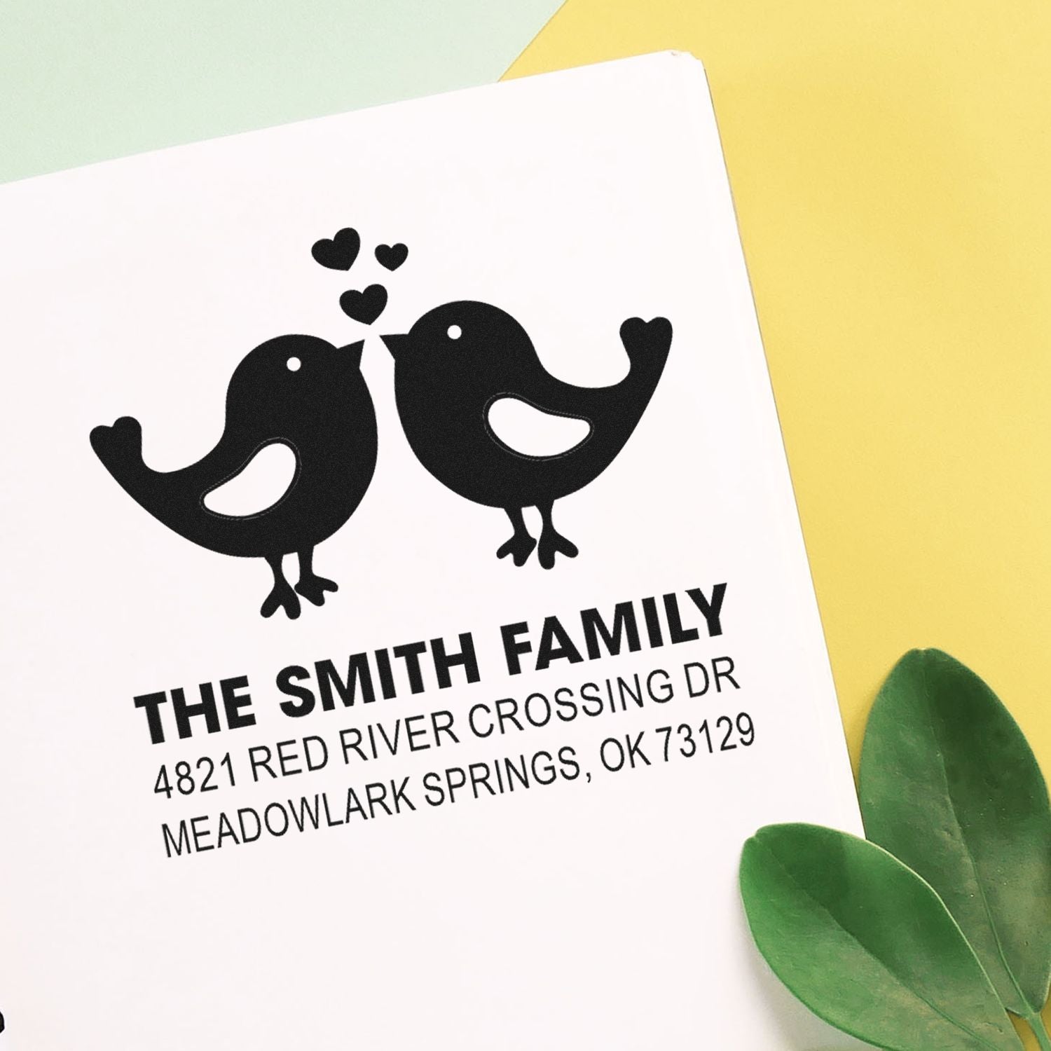 Custom rubber return address stamp with two birds and hearts design, featuring The Smith Family name and Meadowlark Springs, OK address.