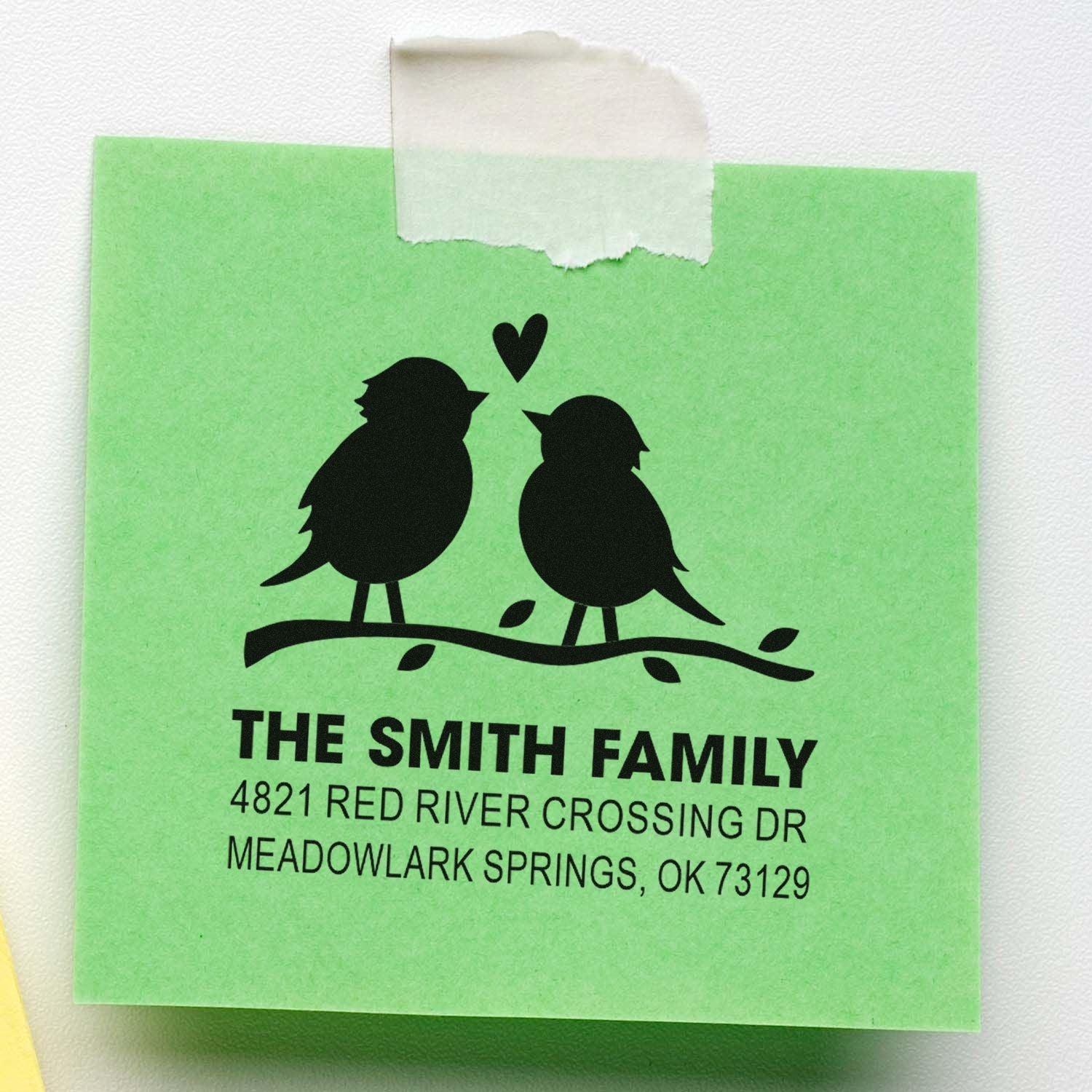 Personalized return address rubber stamp with two birds on a branch, heart accent, and Smith family name with address for mailing envelopes.