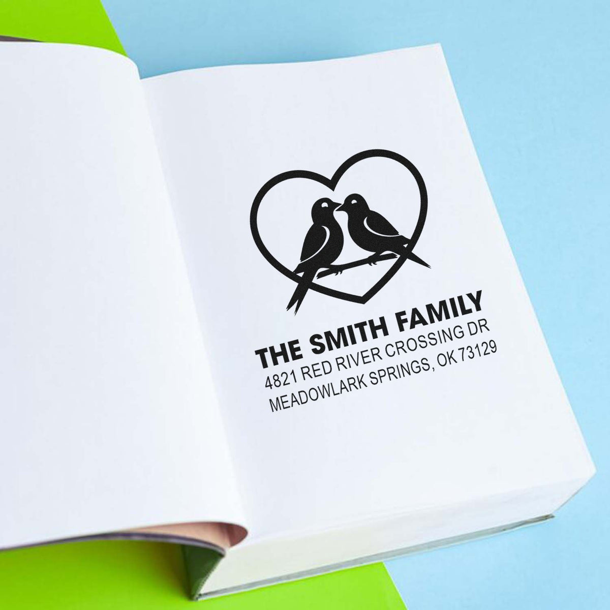 Custom rubber address stamp with heart and birds design, personalized family name, street address, and city state ZIP for wedding or home use