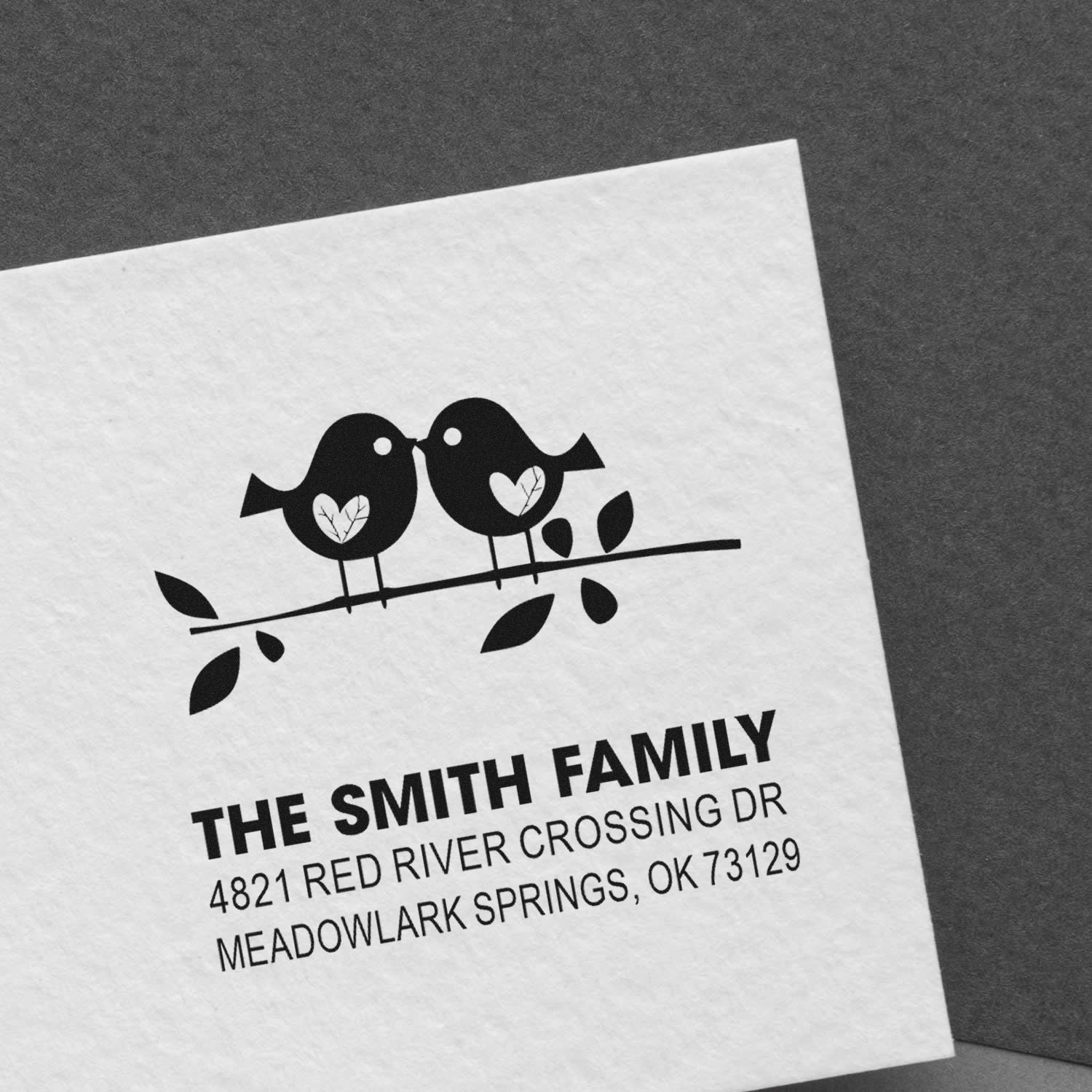 Custom return address rubber stamp featuring two birds on a branch with leaves, personalized with The Smith Family name and mailing address.