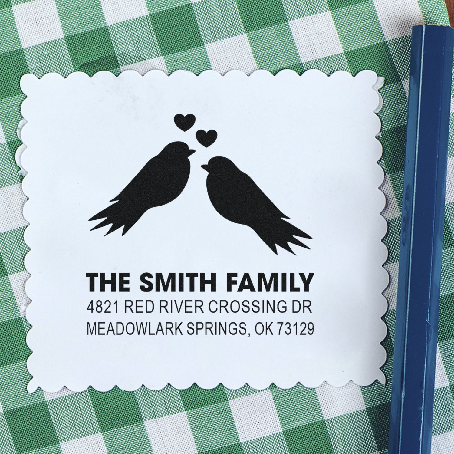 Custom return address rubber stamp with two birds and hearts, scalloped border, personalized Smith family name and Oklahoma mailing address.