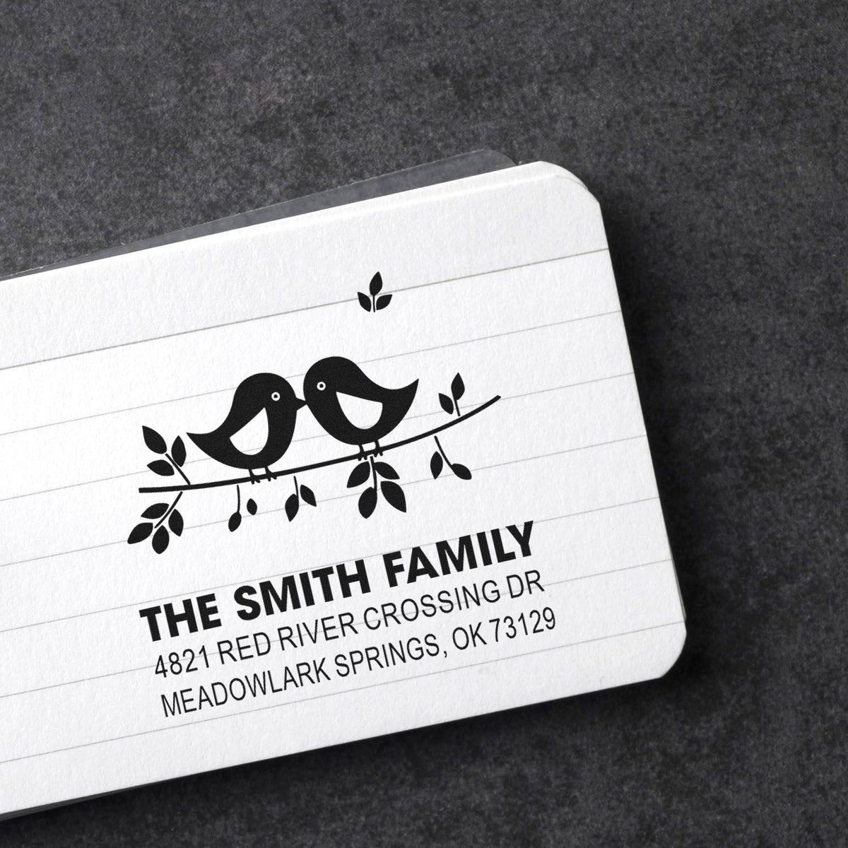 Custom family address rubber stamp with two birds on a branch, featuring The Smith Family name and Meadowlark Springs, OK return address.