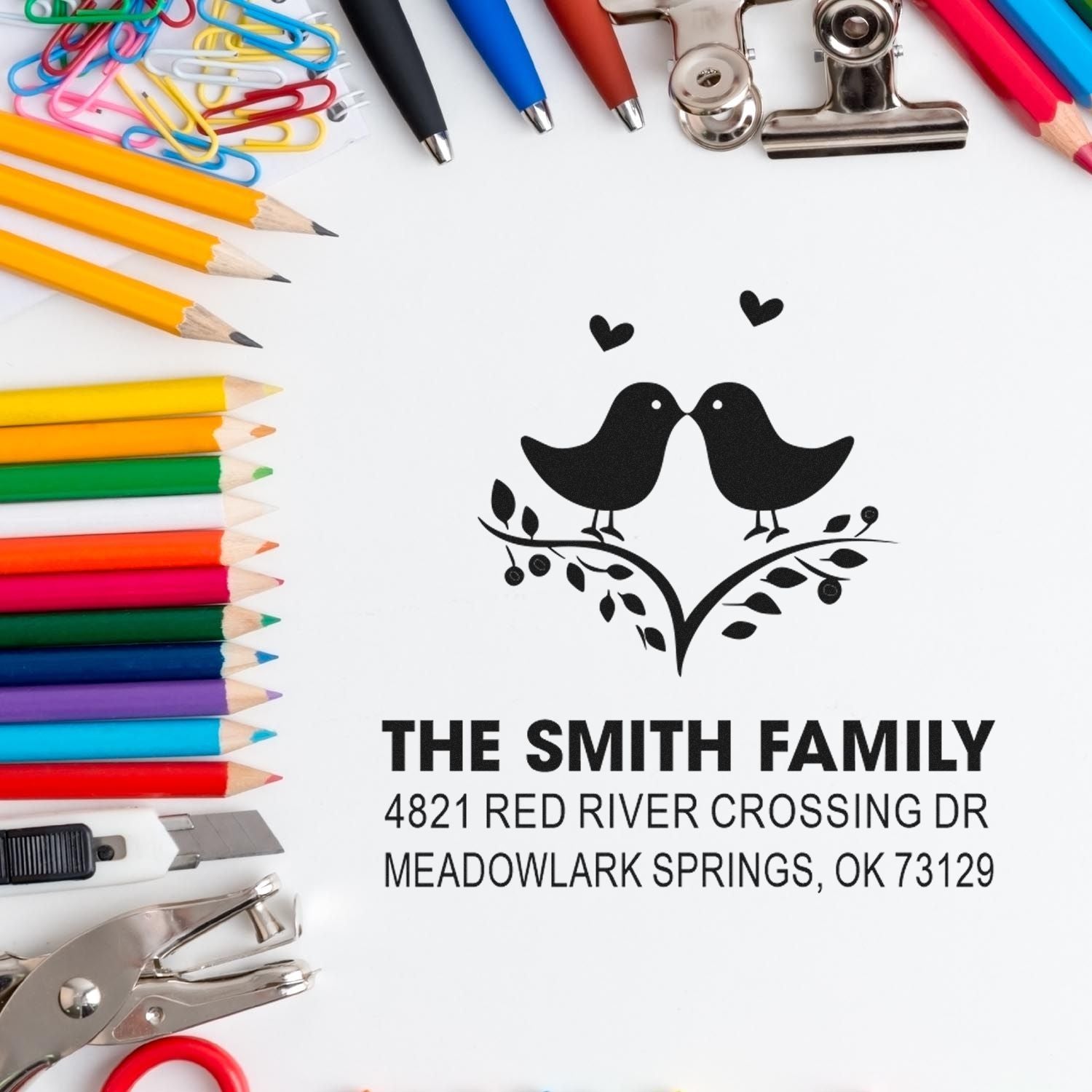 Custom self-inking rubber stamp address stamp with birds and hearts for The Smith Family, featuring personalized return address and office stationery tools.
