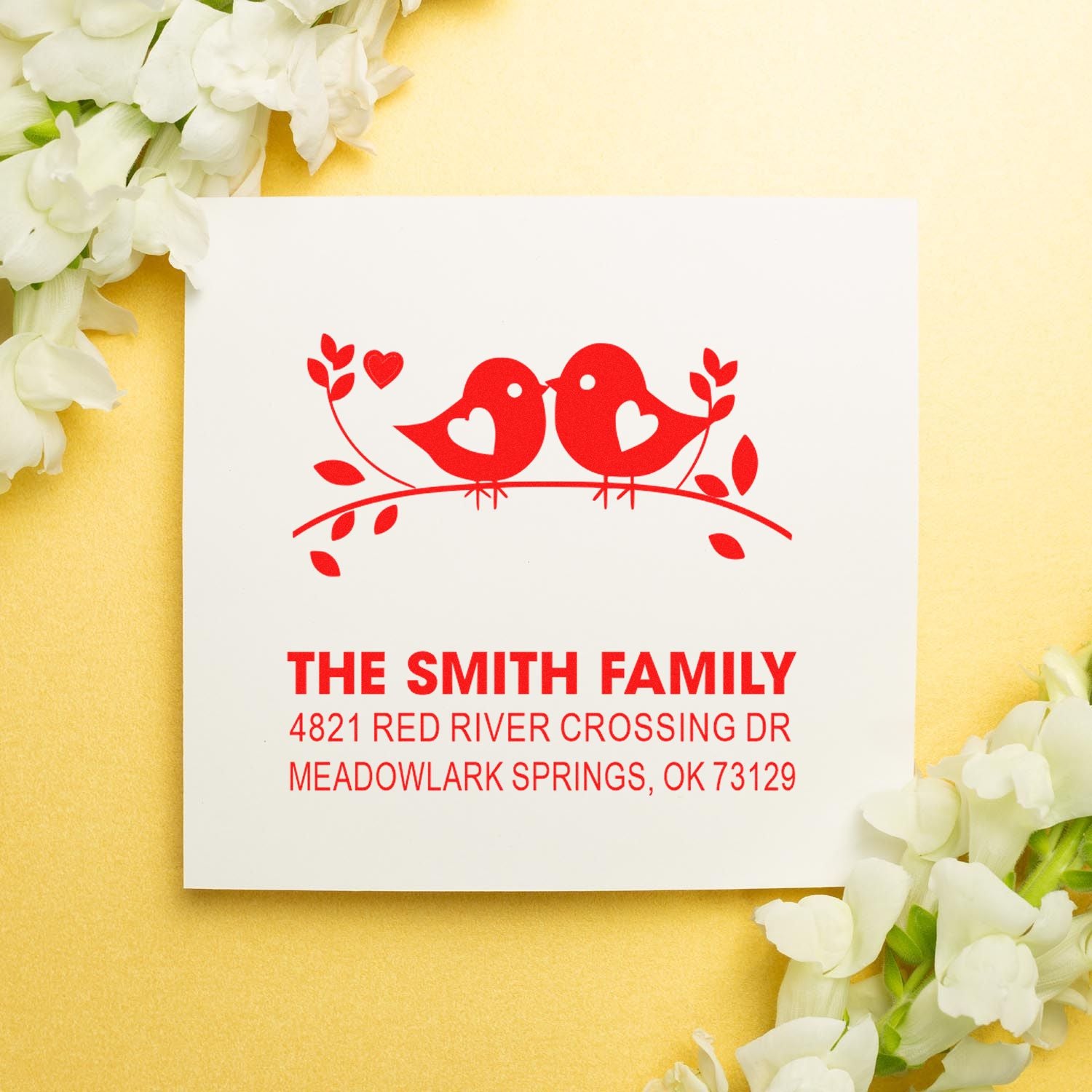 Custom self-inking rubber stamp with two lovebirds and hearts, personalized family name and address, ideal for wedding invitations or envelopes