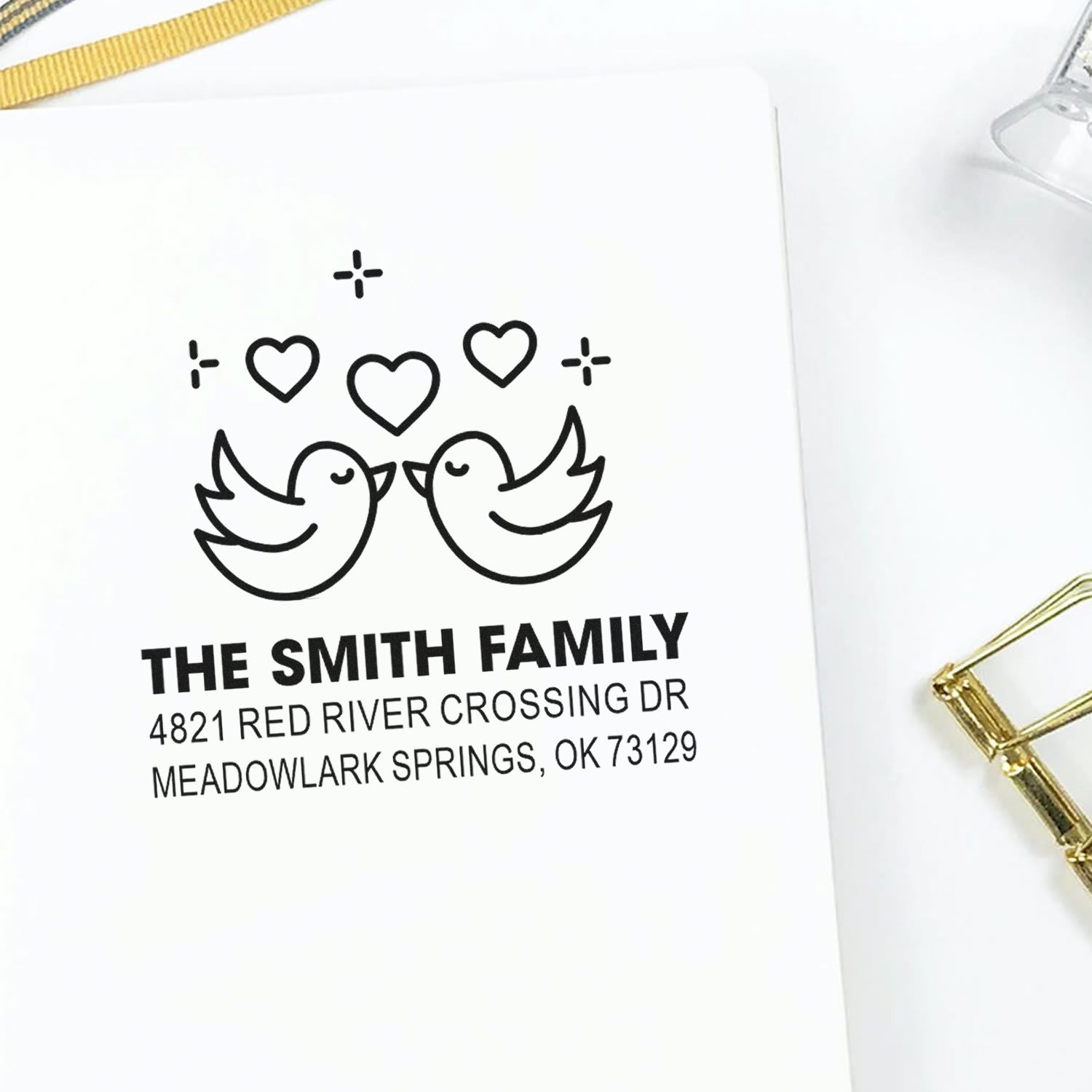 Personalized return address rubber stamp with two birds, hearts, and custom family name for wedding invitations, envelopes, and stationery.