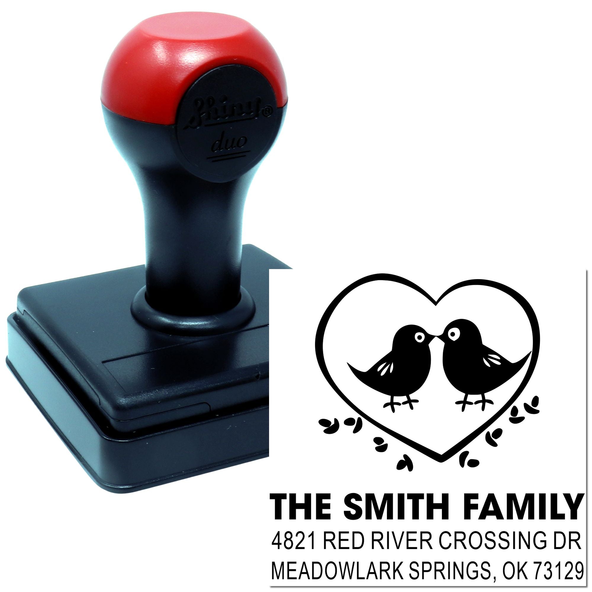 Custom self-inking rubber address stamp with heart and bird design, The Smith Family name, and return address for personalized mailing use.