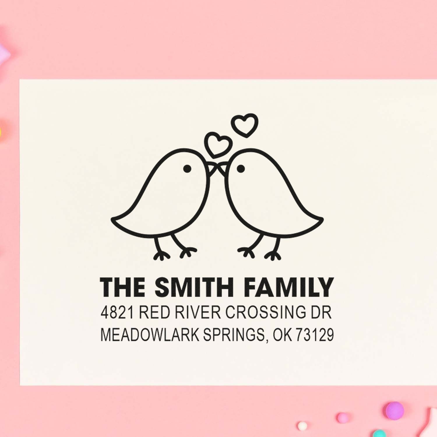 Custom family return address rubber stamp with two kissing birds and hearts, featuring The Smith Family name and Meadowlark Springs, OK address.