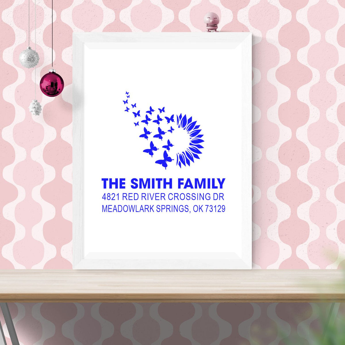 Custom return address rubber stamp with blue butterfly and sunflower design for The Smith Family, featuring personalized name and Meadowlark Springs address.