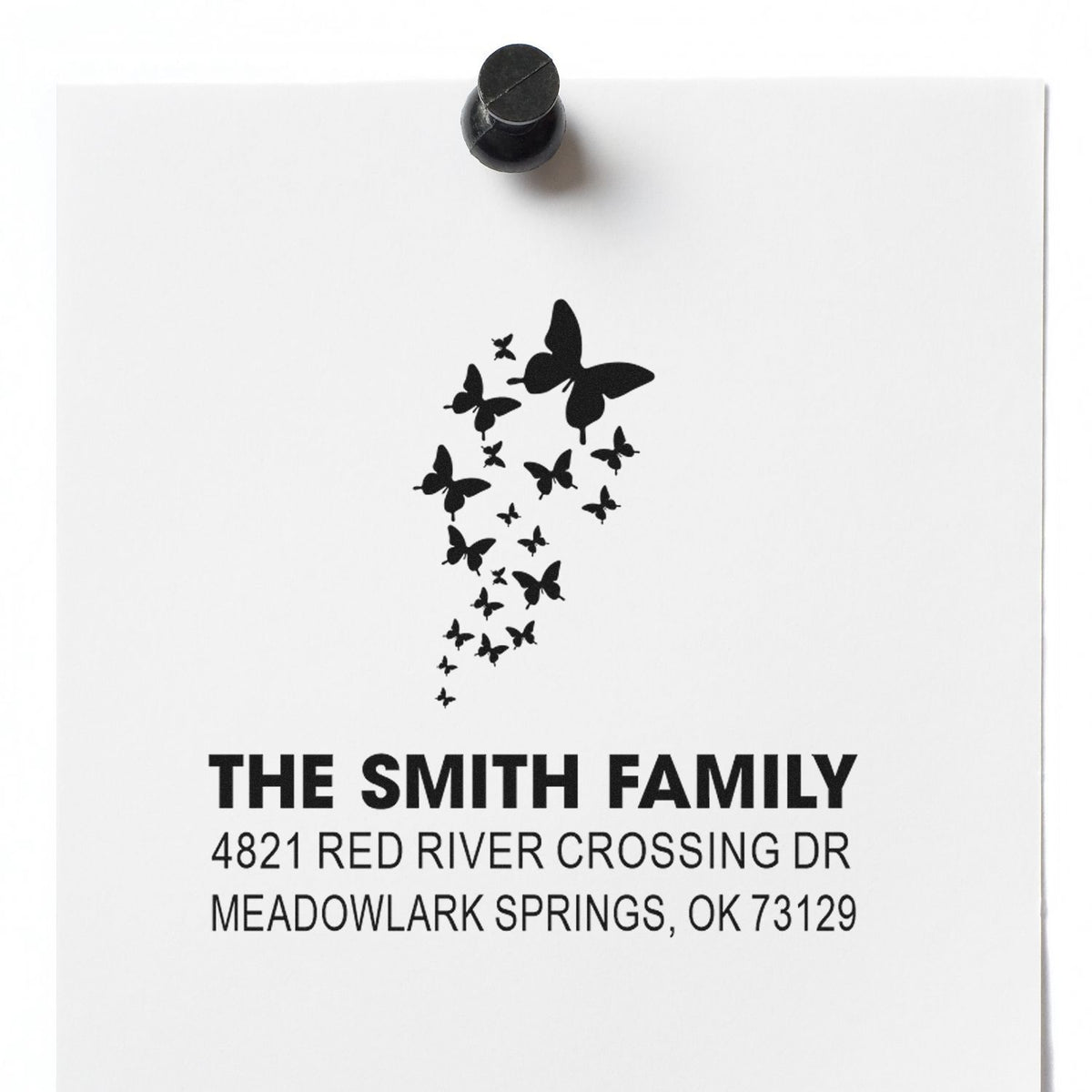 Custom rubber address stamp with butterfly design, personalized Smith family name and return address for envelopes, mail, and packaging.