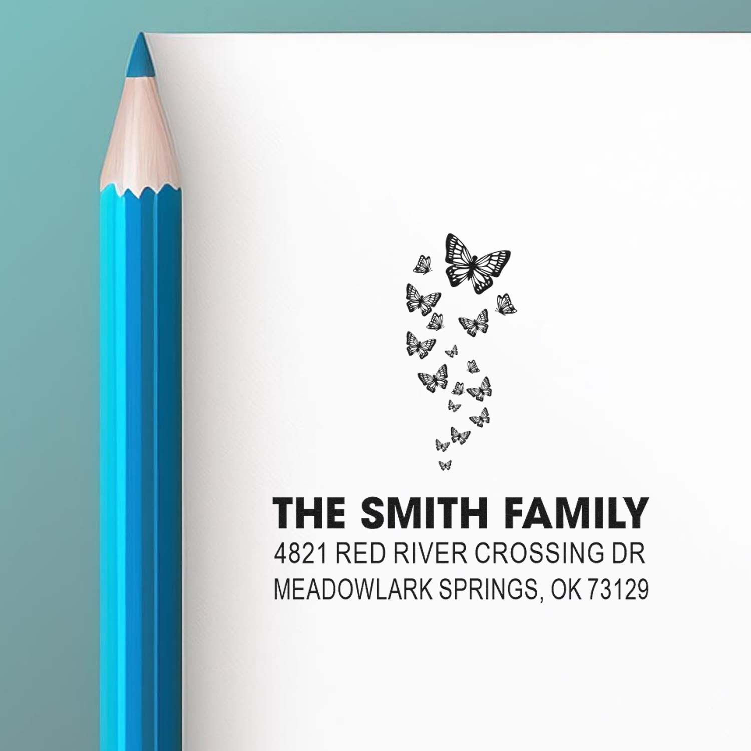 Custom butterfly return address rubber stamp for The Smith Family, featuring decorative butterflies and personalized home address for mailings.