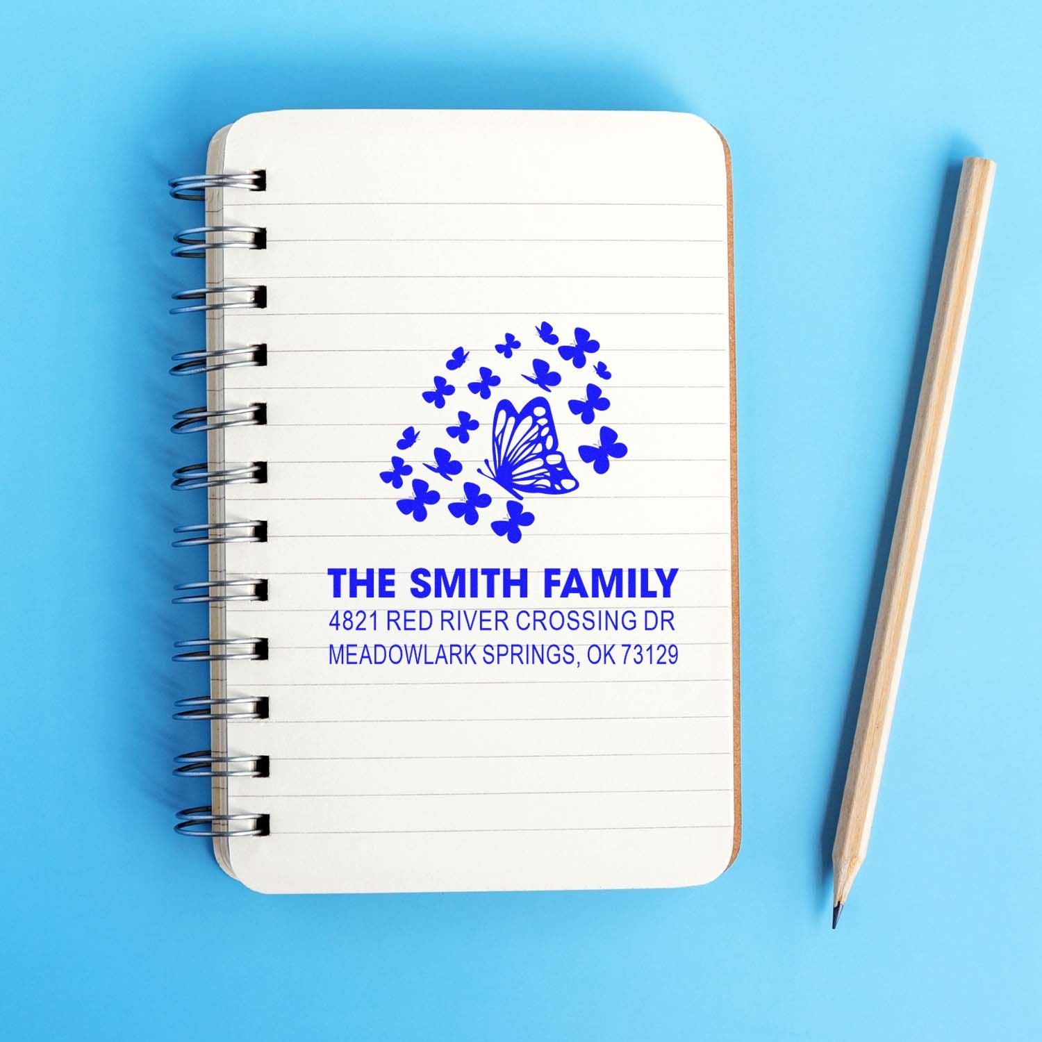 Custom butterfly return address rubber stamp with The Smith Family name and address, featuring floral accent design for envelopes, cards, and stationery.